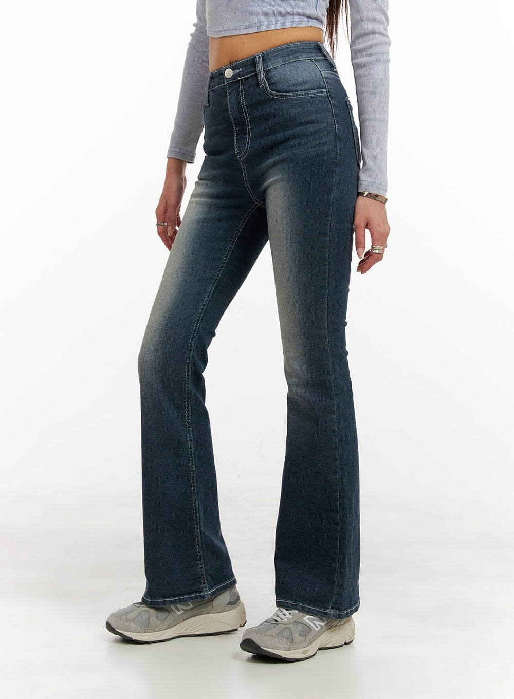 Washed Denim Slim Fit Bootcut Jeans CY402 in blue, side-angle close-up on model from waist to hem, showing slim thigh fit, bootcut flare, contrast stitching, and faded wash detail.