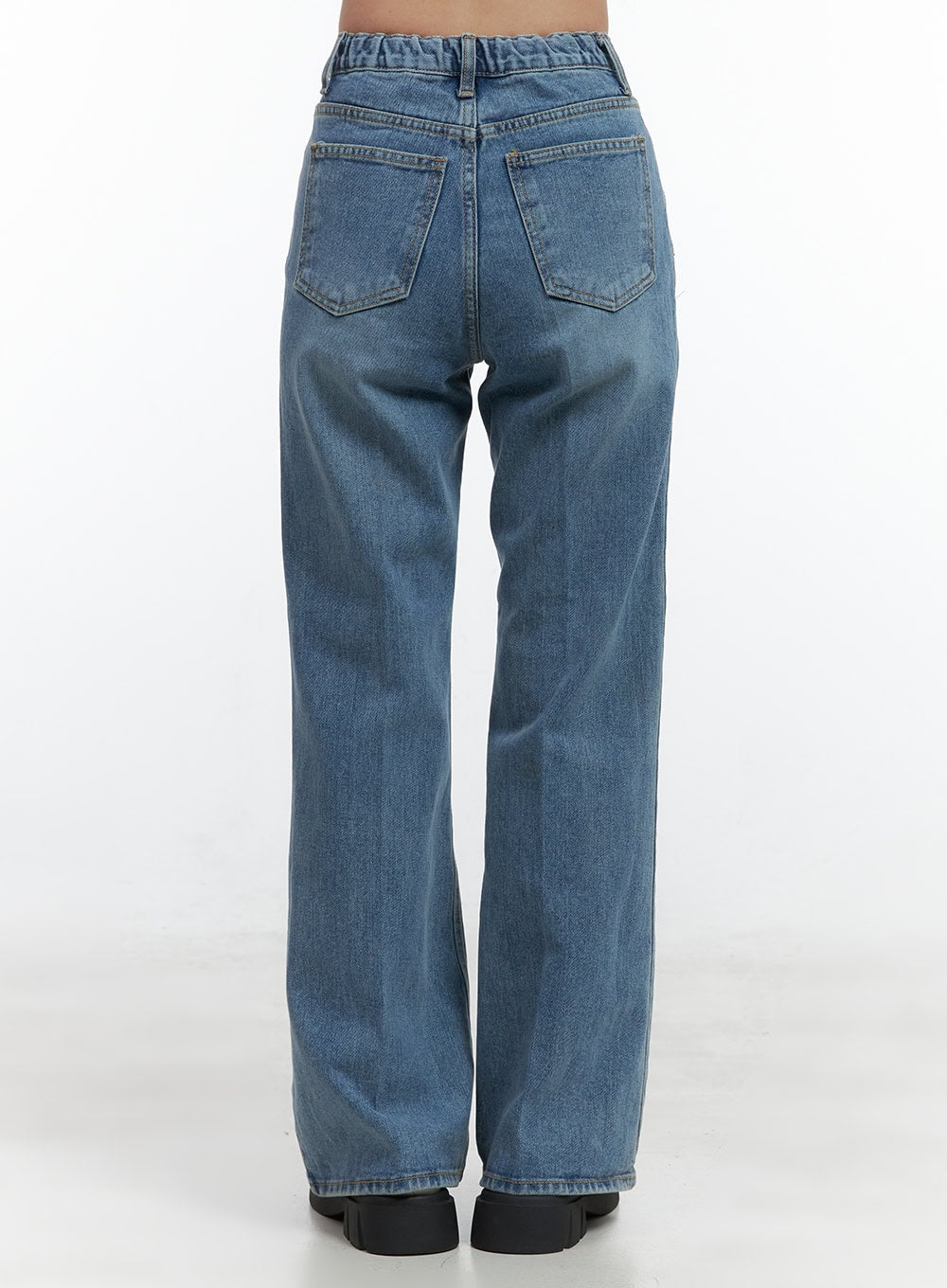 Aubrey Washed Classic Straight-Fit Jeans OO421 in blue, back close-up product shot on model, dual back patch pockets on washed cotton denim, elastic waistband detail visible, straight wide leg silhouette.