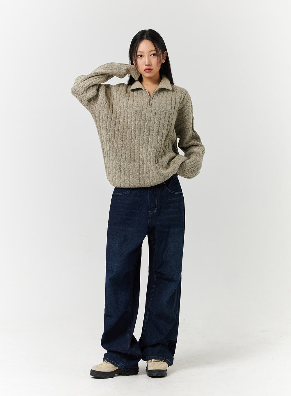Unisex High Waist Solid Pocket Straight Leg Jeans CD328 in Blue, full-body front editorial shot on model with hand raised, wide-fit dark indigo denim with high waist, styled with half-zip knit sweater.