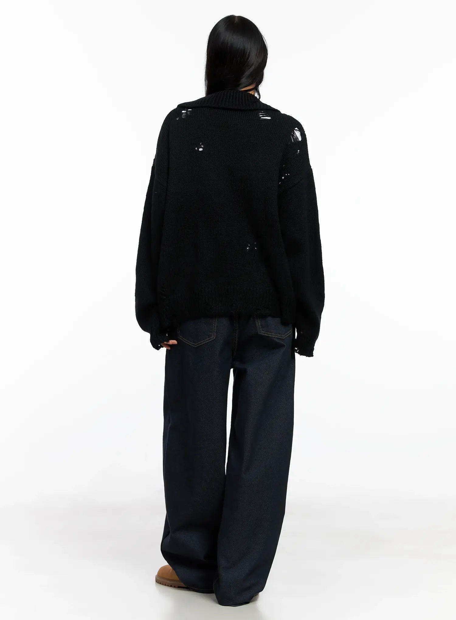 Alanna Sun Belt Baggy Jeans CO528 in dark indigo, back full-body view on model, baggy wide-leg fit with back pockets visible, paired with distressed black knit top and tan shoes.