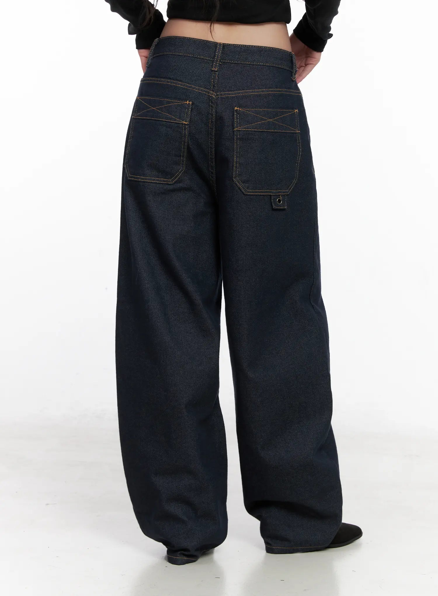 Heaven Wide-Leg Dark Washed Jeans CN513 in dark blue, back view product shot on model, large square patch pockets with contrast cross stitching and branded rivet tab clearly visible.