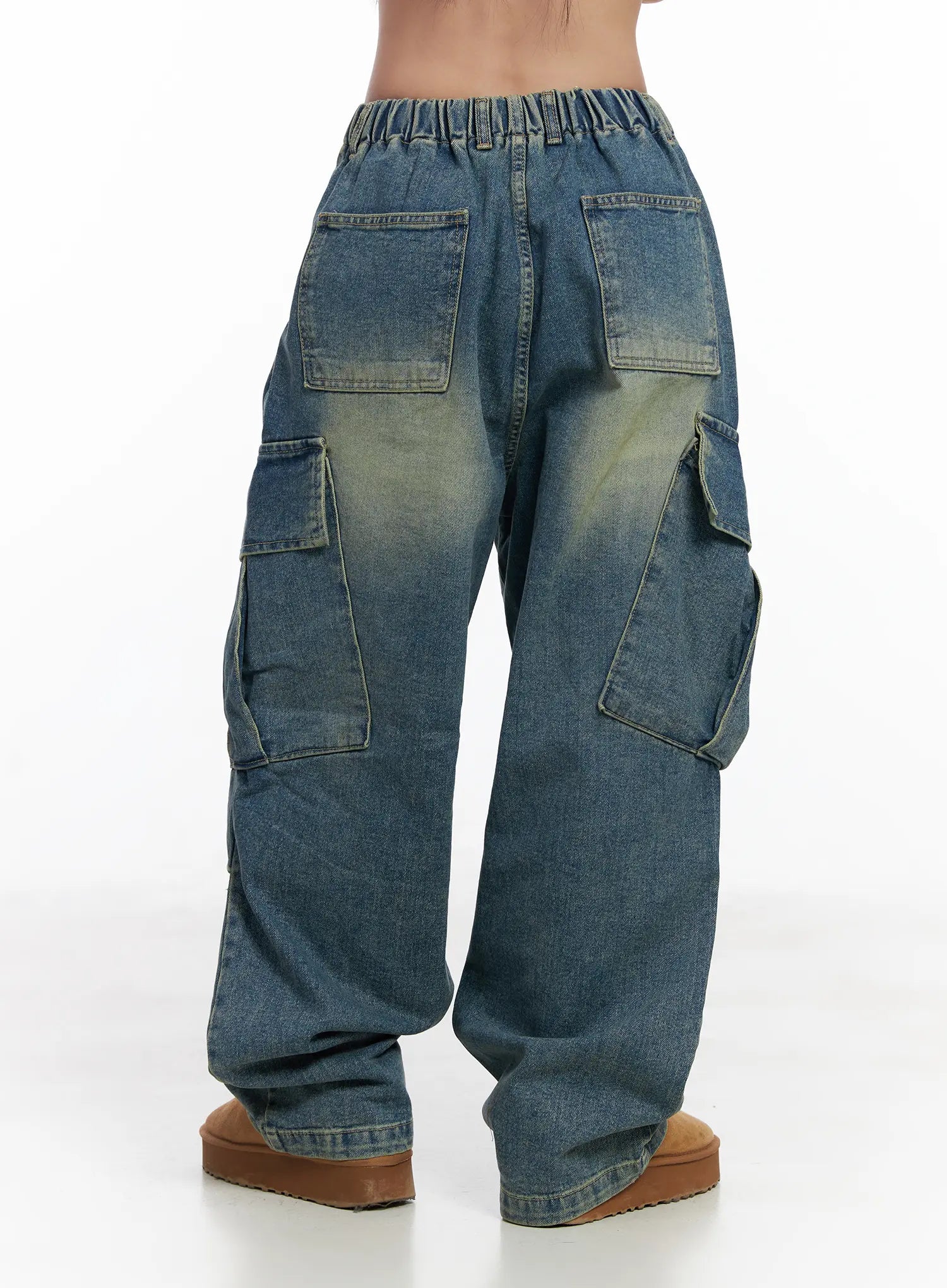 Jake Wide-Leg Cargo Jeans CJ515 in blue, full back product shot on model, showing elastic waist, back patch pockets, rear cargo flap pockets, and wide-leg washed denim, with tan boots.
