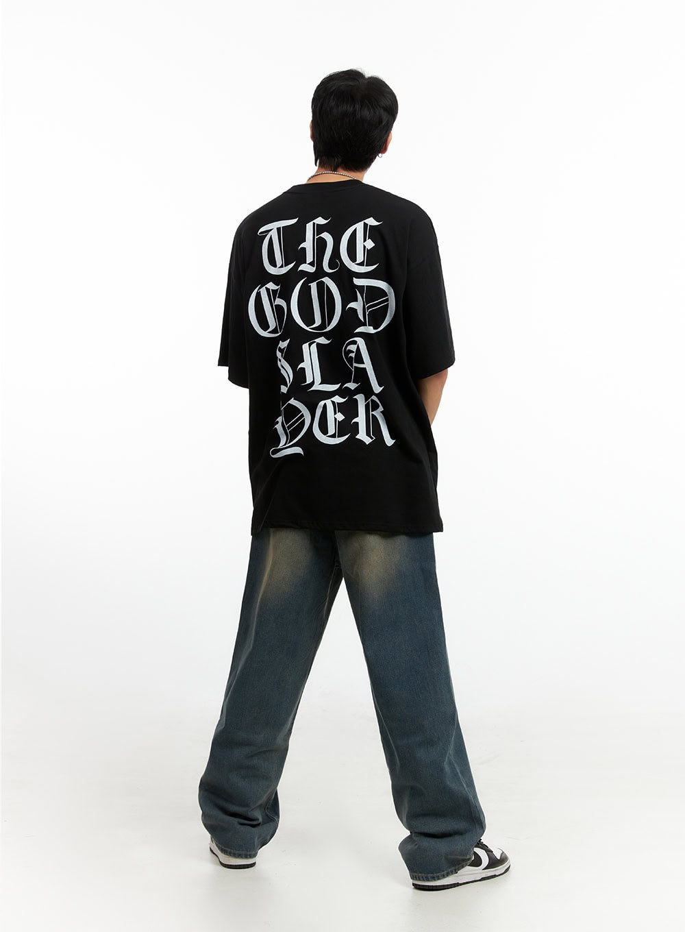 Men's Vintage Washed Loose Fit Jeans (Dark Blue) IG402, back full-length view on model, loose wide-leg silhouette with vintage fading, paired with black gothic-print oversized tee and sneakers.