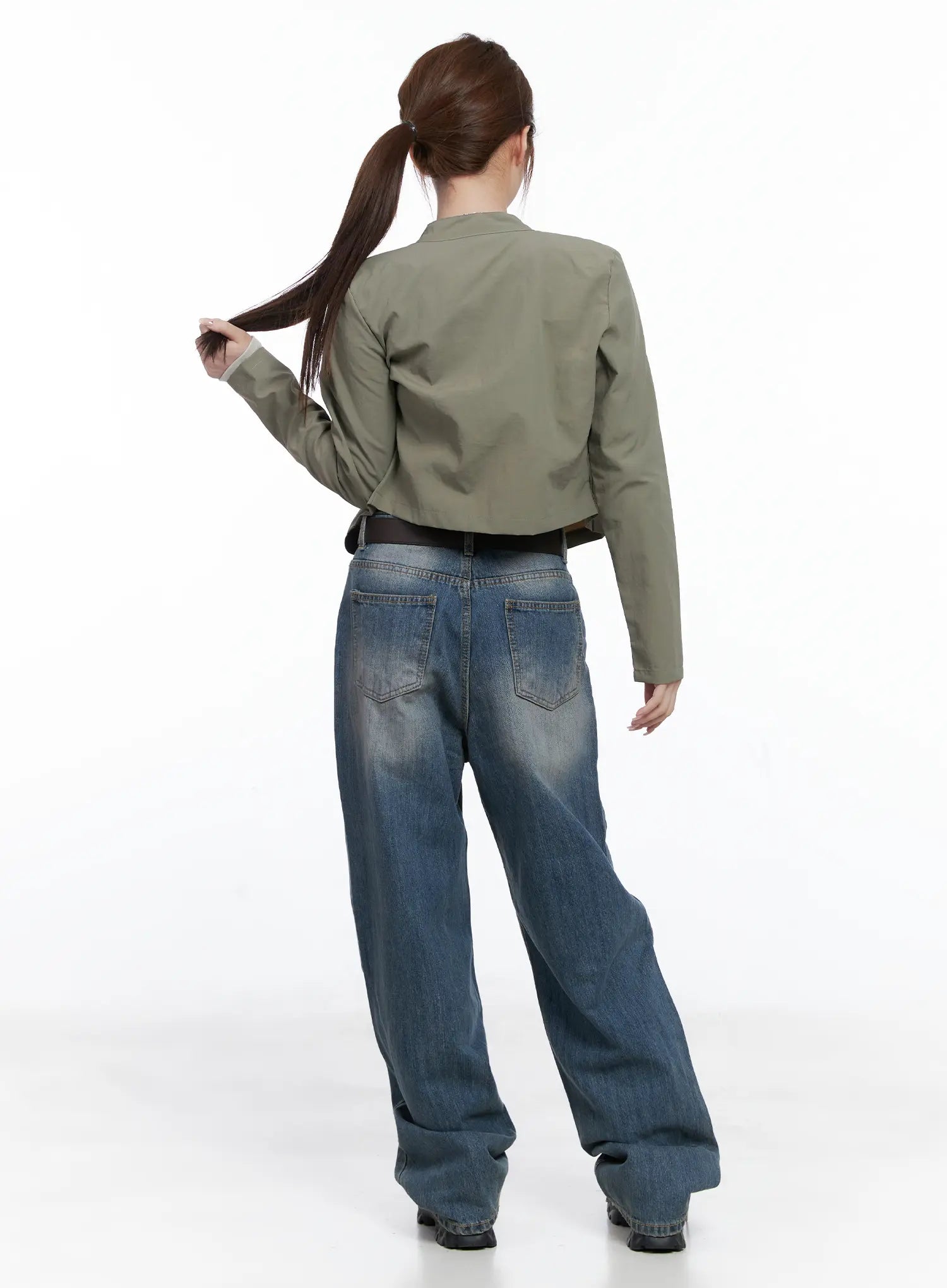 Lala Wide Leg Vintage Washed Jeans CG529 in blue, back full-body shot on model, styled with olive crop jacket and brown belt, revealing back pockets and relaxed wide-leg drape.