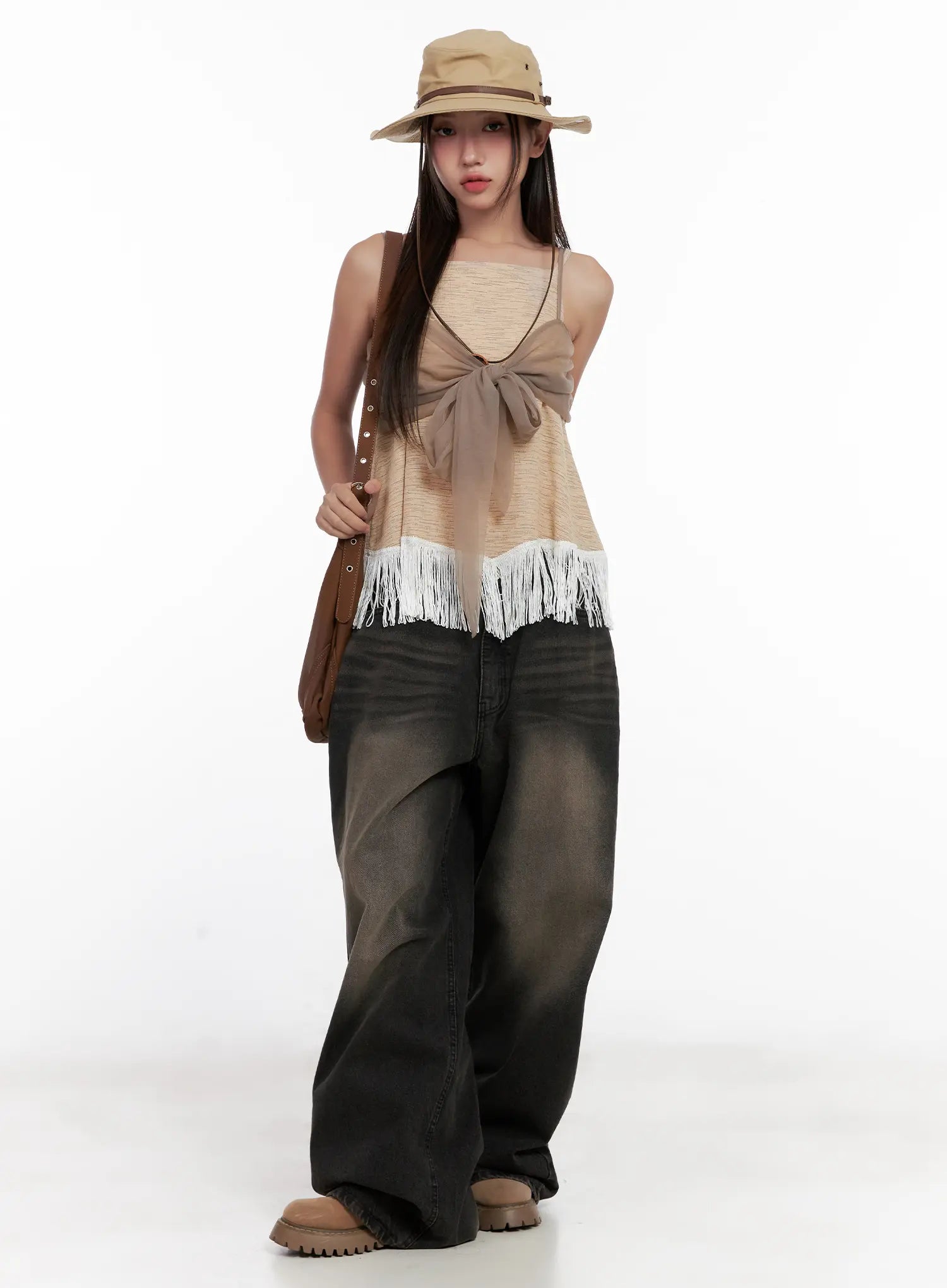 Ari Washed Wide-Leg Denim Jeans CL521 in Black, full-body styled shot on model, wide cotton leg with washed fade, paired with fringe cami, bucket hat, and brown shoulder bag.