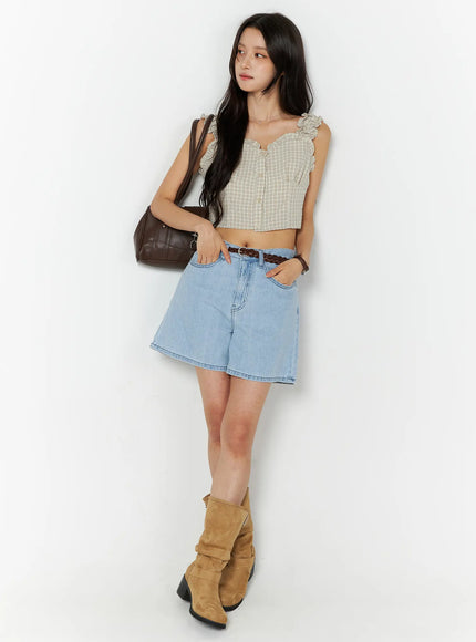 Casual Relaxed-Fit Jorts CU522 in light blue, full-body front angled shot on model, high-waist wide-leg denim shorts with braided belt, styled with plaid top and brown shoulder bag.