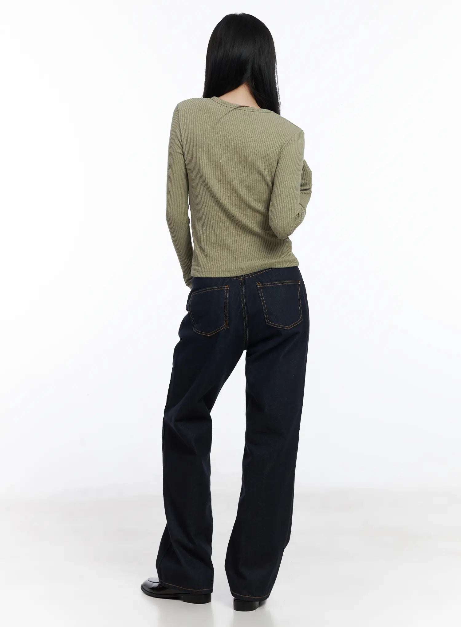 Mingi Non-Fade Semi-Wide Belted Jeans CJ519 in dark blue, back styling shot on model, back pockets with contrast stitching, wide-leg length, paired with sage ribbed long-sleeve top.