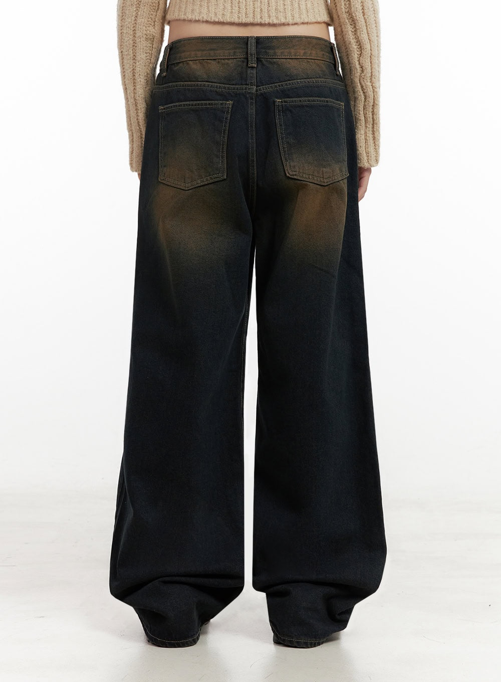 Alexia Washed Denim Wide-Leg Jeans ID402 in dark blue, back close-up on model, washed denim with brown fade at yoke, two back patch pockets, wide-leg hem pooling on floor.