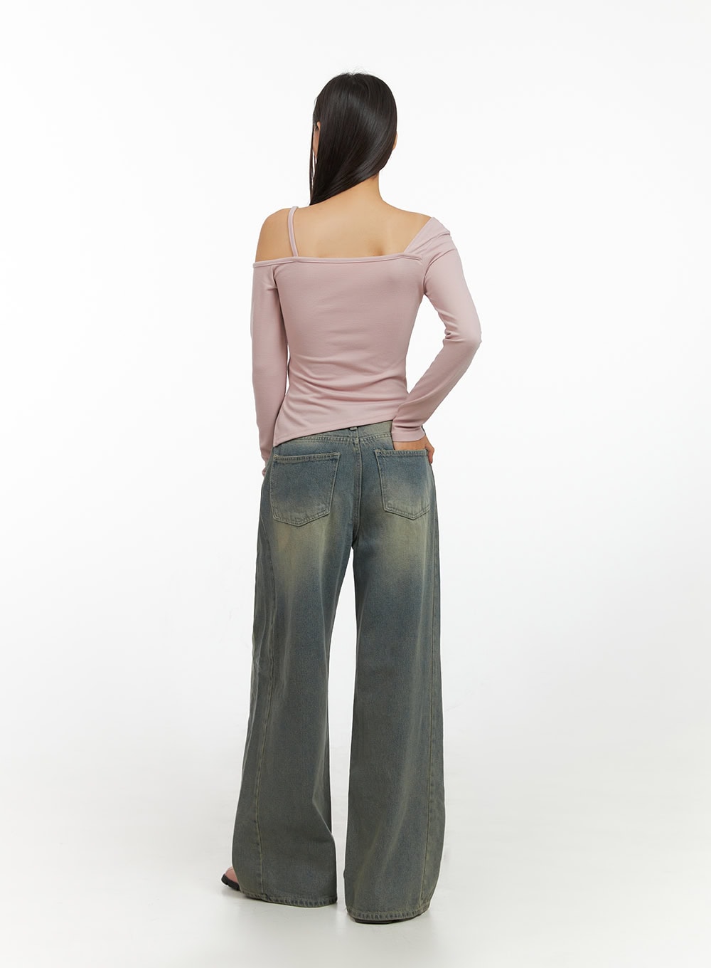Inez Washed Denim Wide Leg Jeans IS427 in vintage green, back full-length view on model, dual back pockets with faded denim wash, paired with pink off-shoulder long-sleeve top.
