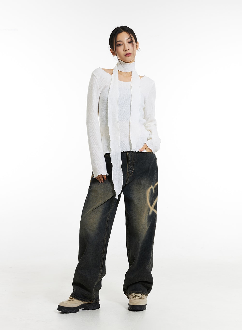 Heart-Bleached Wide Leg Jeans IN308 in dark blue, front full-body shot on model hands-in-pockets pose, white layered knit and scarf styling, washed denim with spray-heart detail, oversized wide fit.