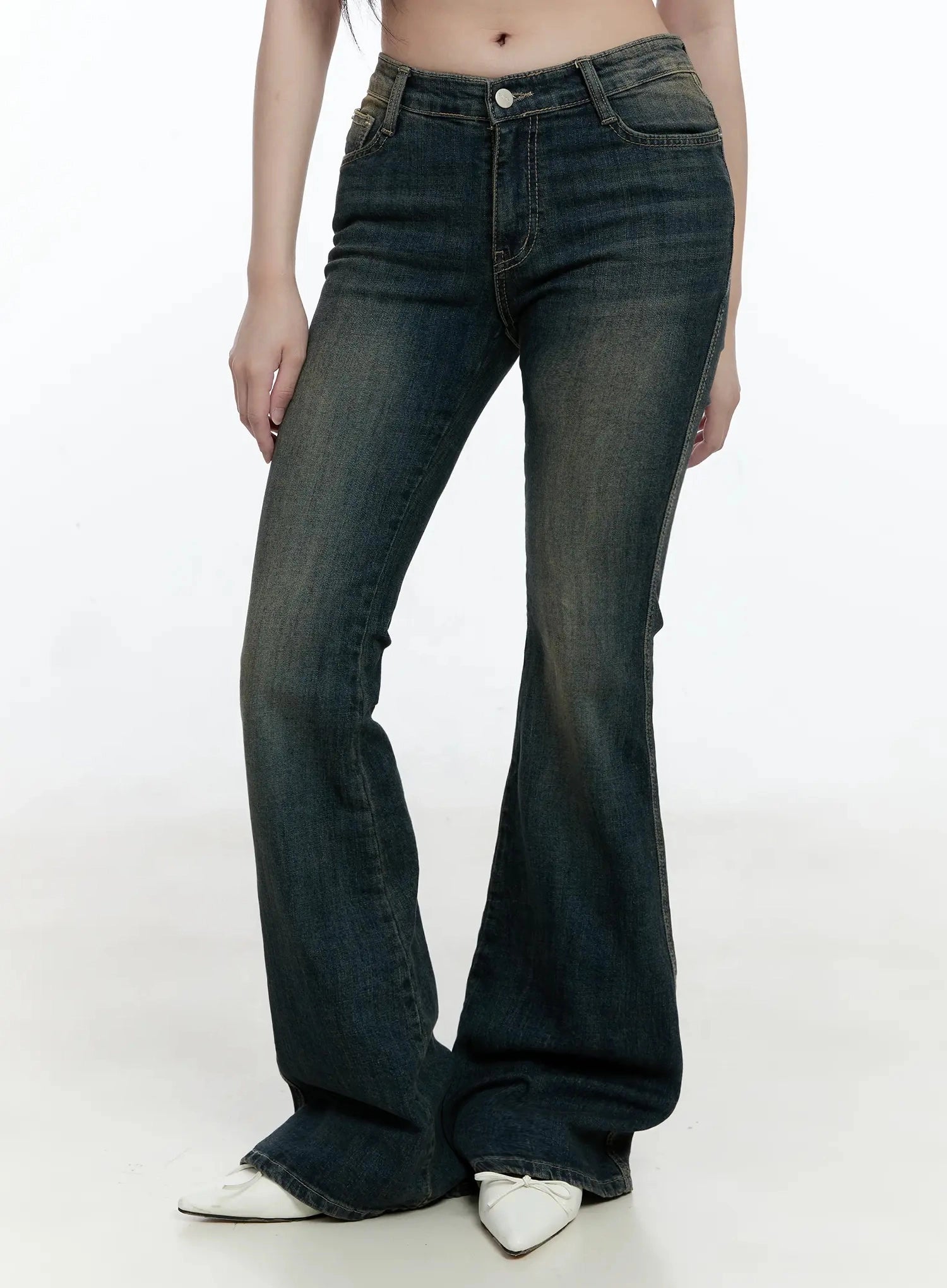 Karla Vintage Logo Hip Pad Flare Jeans IO520 in washed dark blue, front bottom half on model, hip-to-hem view highlighting slim fit, flare hem, and washed cotton-spandex fabric.