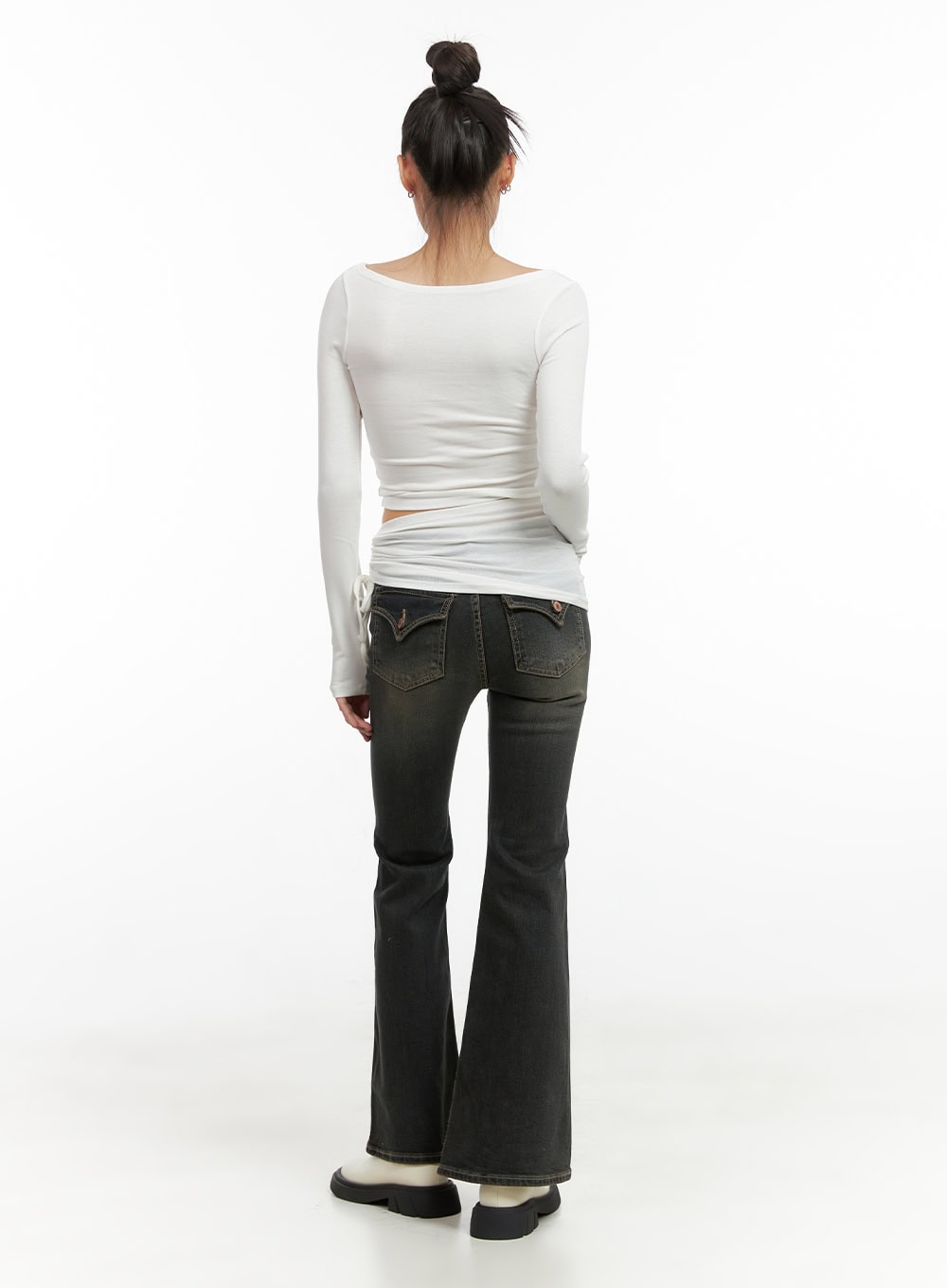 Paisley Slim-Fit Bootcut Washed Jeans CO424 in dark blue, full-length back view on model, slim-to-bootcut silhouette showing flare at ankle, V-pocket stitching, paired with white long-sleeve top.