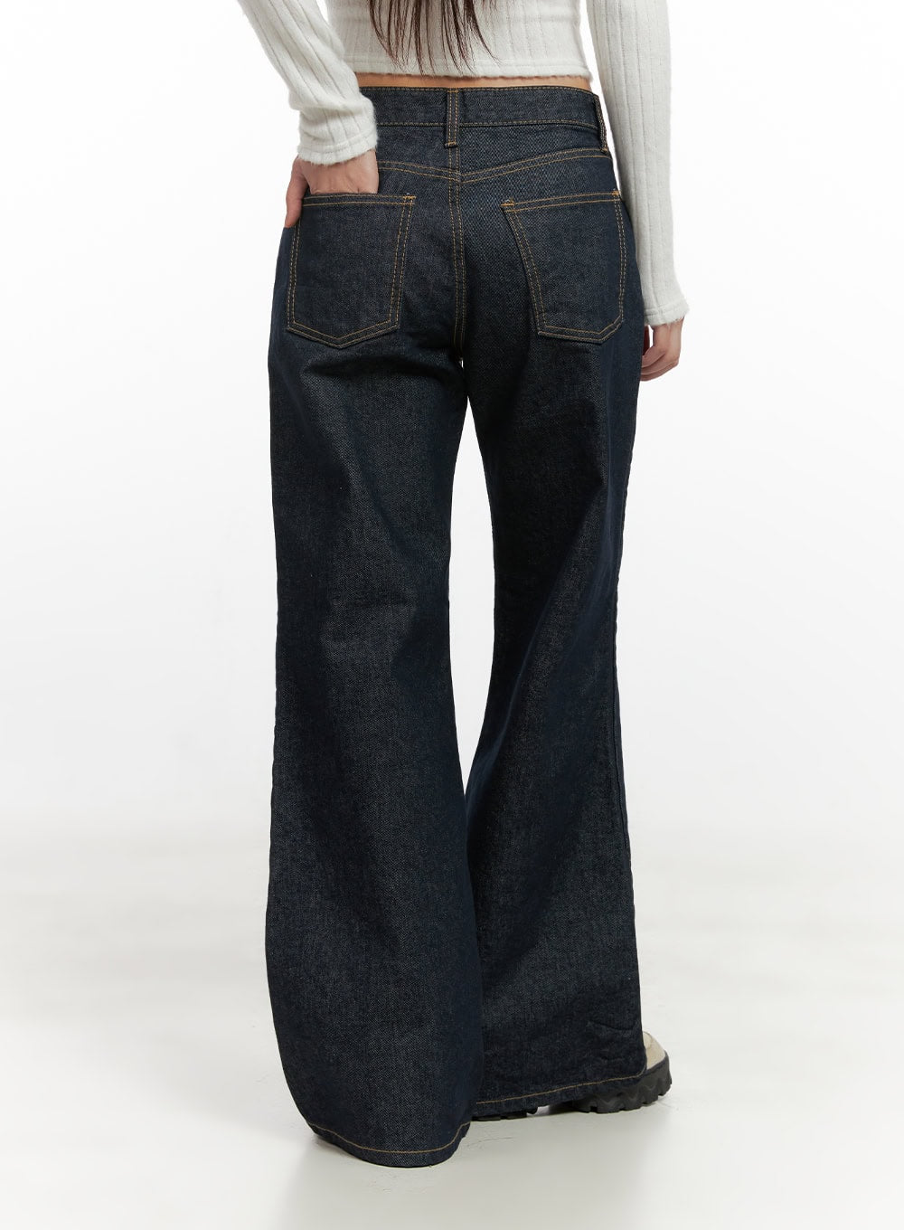Lisa Cotton Comfort Wide Leg Jeans CN419 in dark blue, back close-up on model, cotton denim showcasing back patch pockets with contrast gold topstitch and wide-leg hem sweep, with white ribbed crop top.