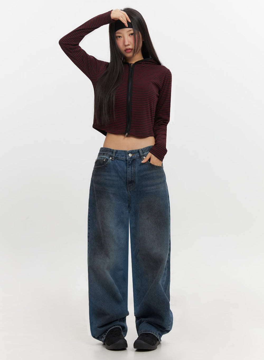 Brianna Dark Washed Wide-Leg Jeans IF510 in dark washed blue, full-body front on model with hand raised to forehead, relaxed baggy wide-leg fit, dark wash denim pooling at hem, acubi street style.
