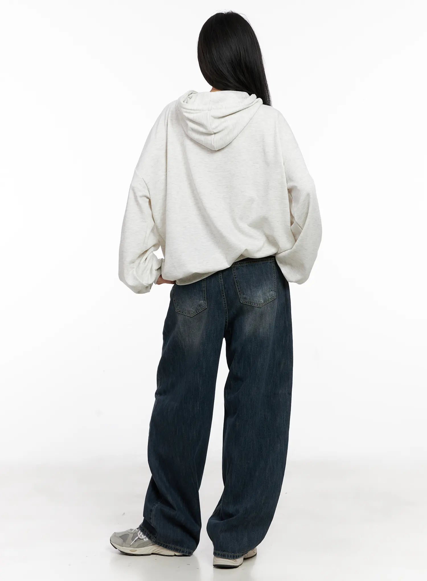 Seoy Washed Denim Jeans CG525 in dark blue, back full-body shot on model, dual back pockets and washed denim texture visible, paired with oatmeal hoodie.
