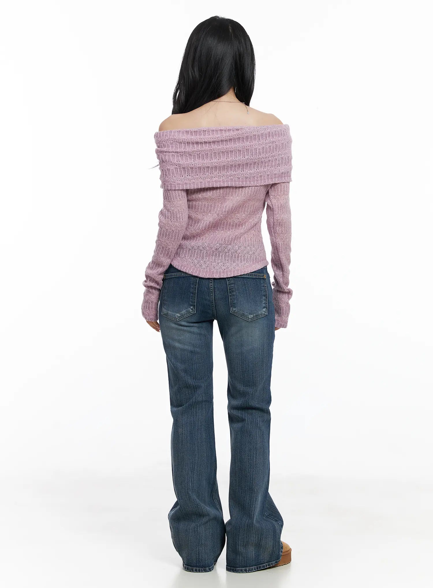 Astrid Low Rise Flared Bootcut Jeans CJ514 in blue, full-length back styling shot on model, back pockets and flared bootcut hem visible, paired with pink off-shoulder knit and tan platform shoes.