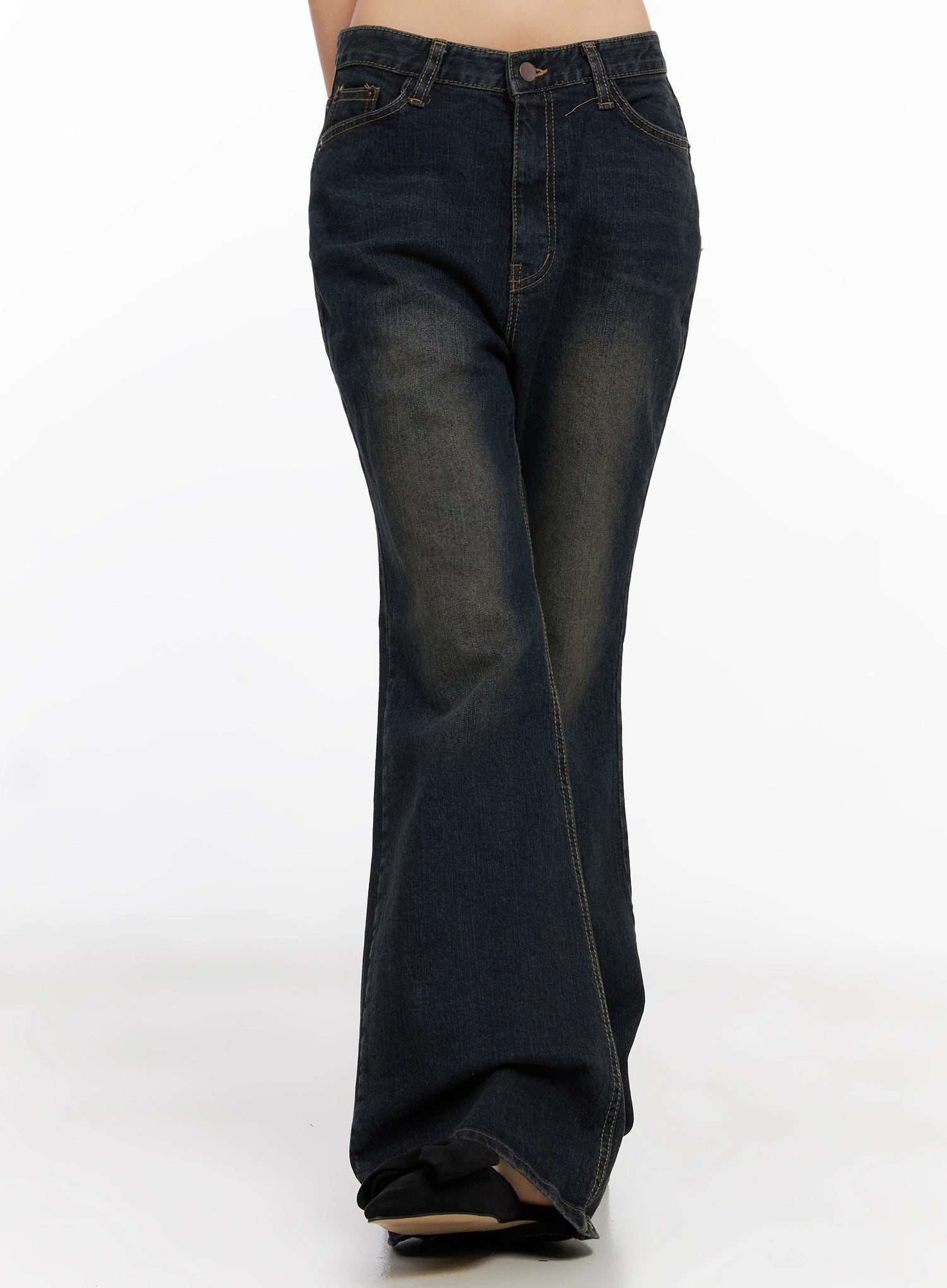 Lyanna Vintage Wash Bootcut Jeans IN503 in dark blue, straight-on front view on model walking pose, five-pocket styling, subtle bootcut flare at hem, vintage wash cotton denim.