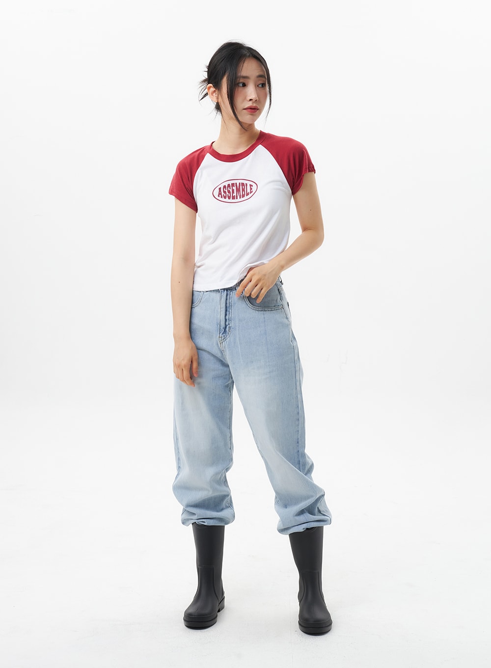 Wide Straight Leg Jeans OL304 in light blue, full-body front shot on model looking down, wide-fit faded denim with high-rise waist, paired with raglan tee and tall black boots.