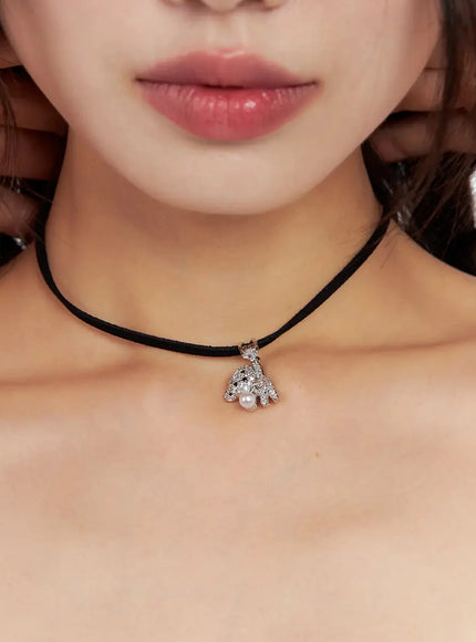 acc-onkapo-teddy-with-a-ball-black-cord-necklace-cg507