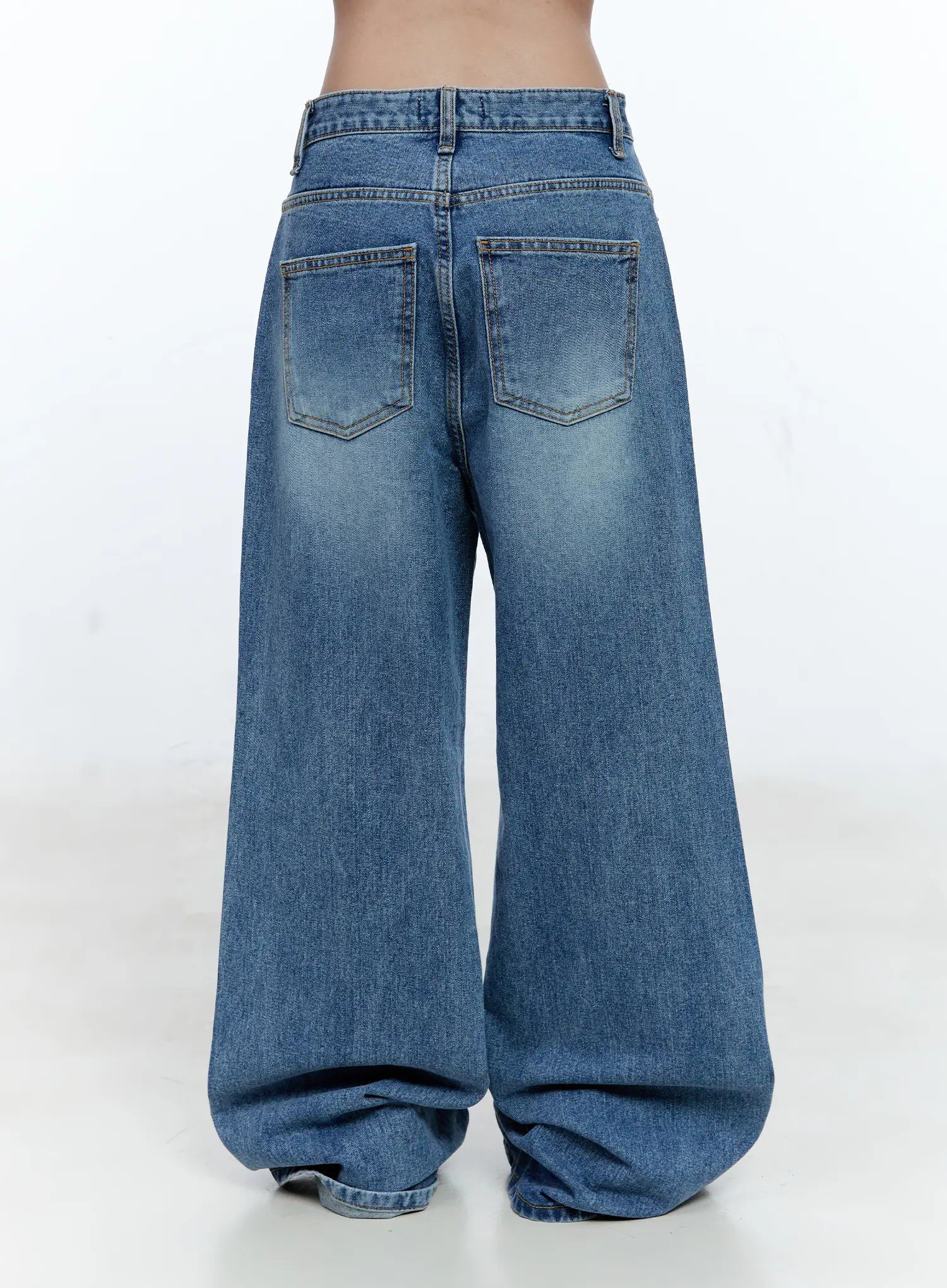 Ana Wide-Leg Denim Jeans CG507 in blue, back product shot on model from waist down, showing dual back patch pockets with contrast stitching and washed cotton wide-leg silhouette.