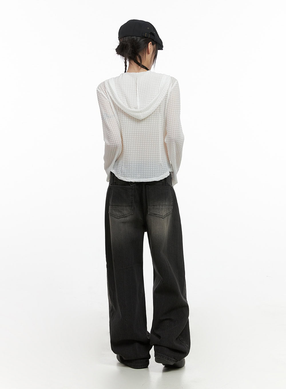 Sage Back-Buttoned Wide Pants CS430 in black, back full-body on model in black cap, wide-leg washed denim with patch pockets visible, paired with white waffle hooded top, back view of complete outfit.
