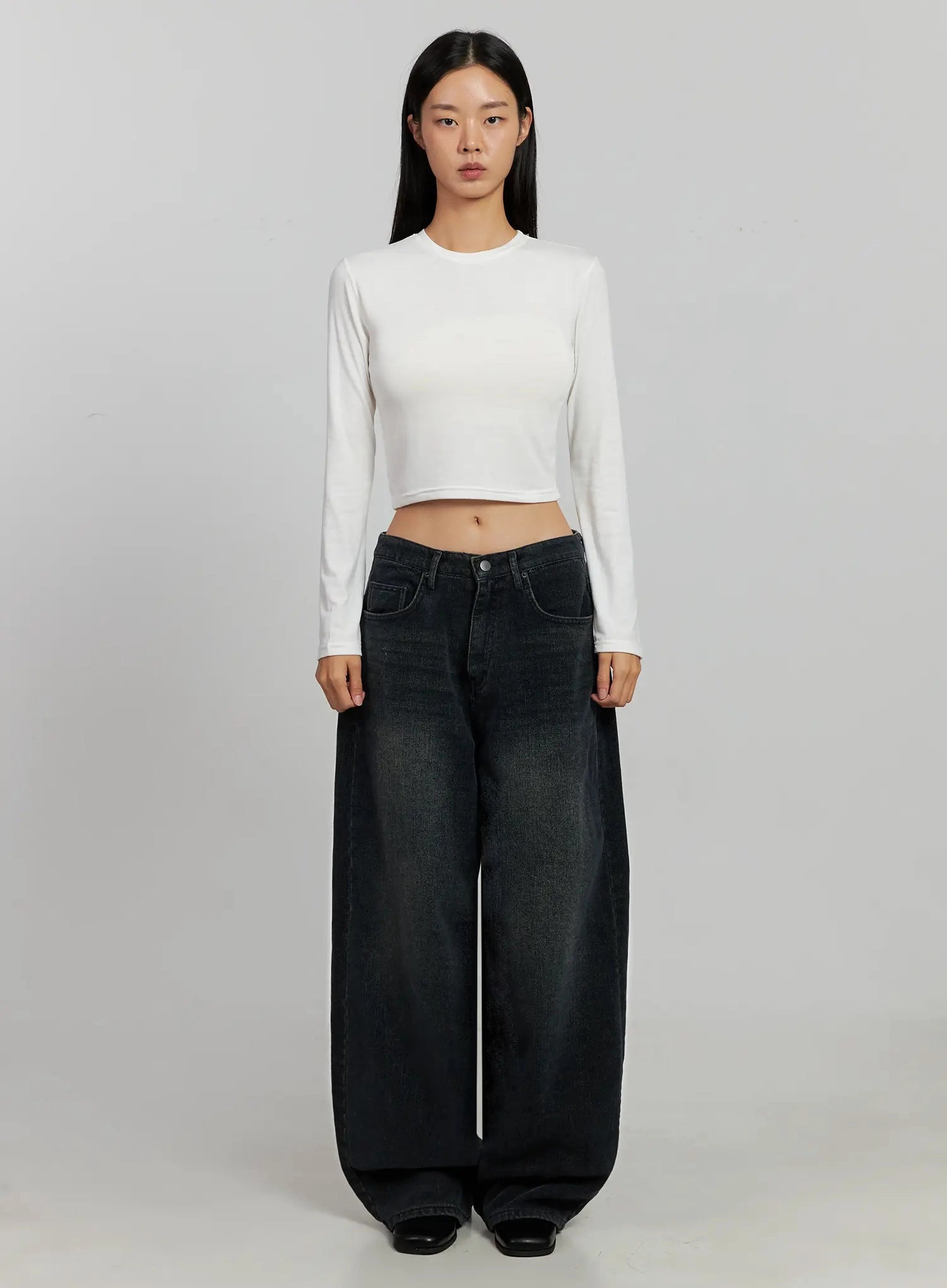 Aubree Washed Wide Jeans IJ502 in dark blue, full-length front-facing shot on model, standing straight, paired with white fitted cropped long-sleeve top and black square-toe mules.