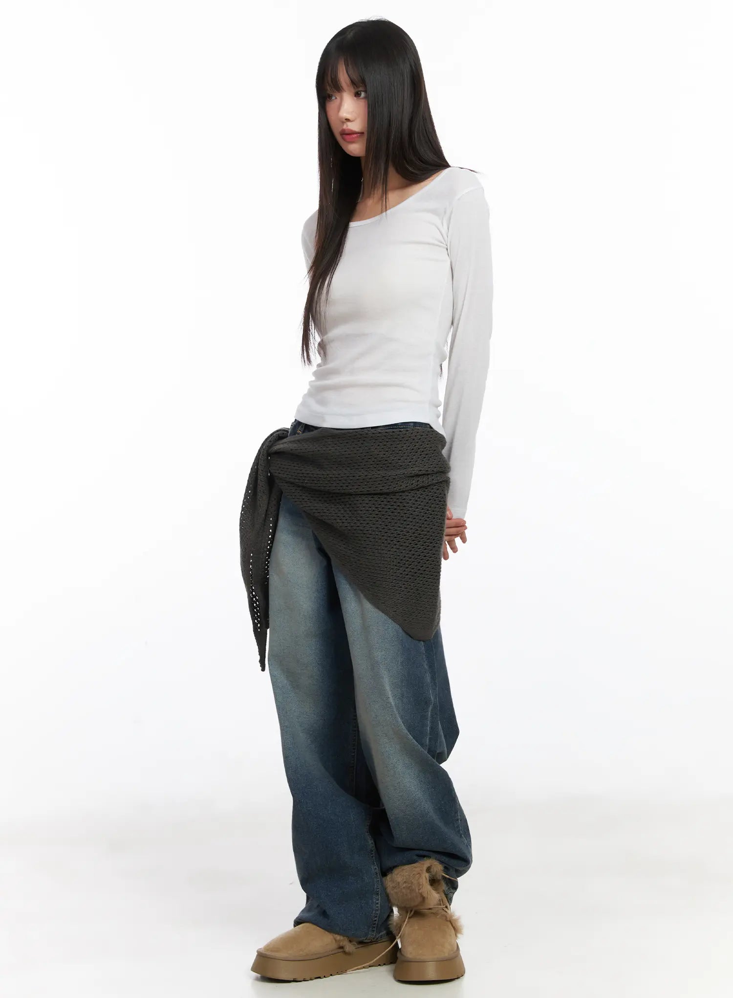 Eliza Fleece-Lined Washed Wide Leg Jeans CD518 in blue, front three-quarter view on model, wide-fit washed denim styled with white long-sleeve top and dark knit wrap tied at waist.