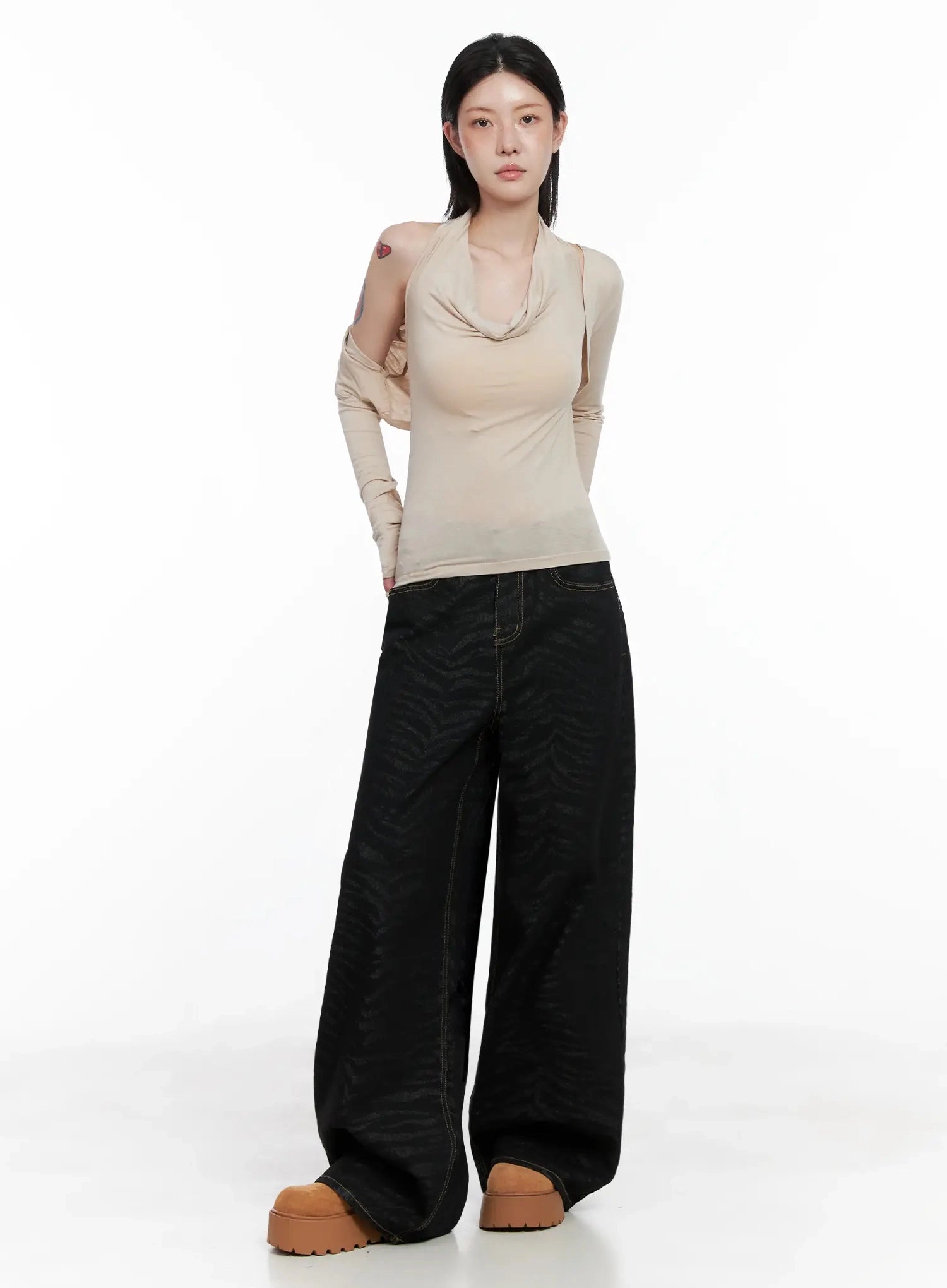 Freyja Animal Print Wide Leg Jeans IS508 in black, full-length front view on model, wide-fit zebra-print cotton denim, styled with beige halter-layered top and chunky platform shoes.