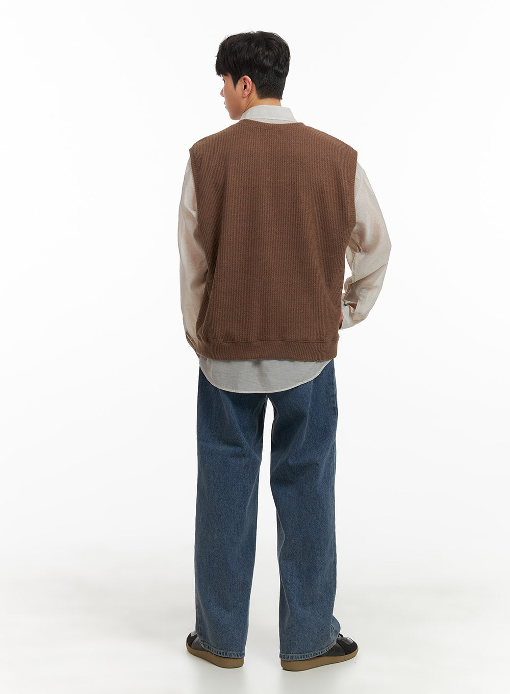 Men's Washed Denim Wide Fit Jeans IA402 in blue, full back view on model, wide leg regular length with clean back pocket stitching, paired with brown knit vest over sheer shirt.