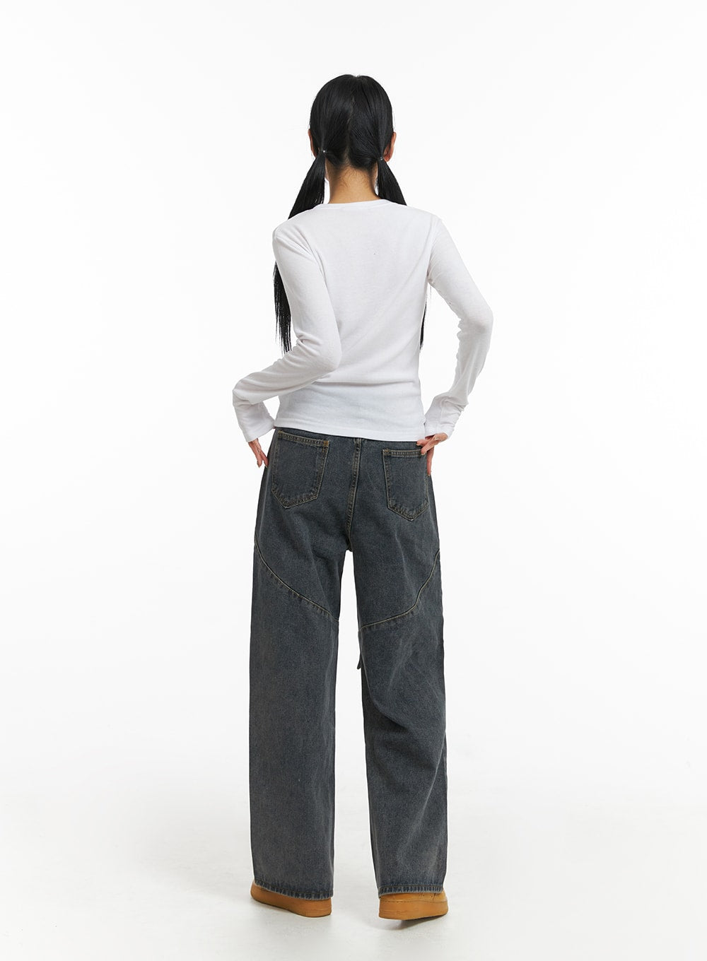 Mid Waist Cargo Jeans CJ411 in dark blue, back view on model, wide-leg washed denim showing twin back pockets, curved panel seams, and clean straight hem, paired with white top.