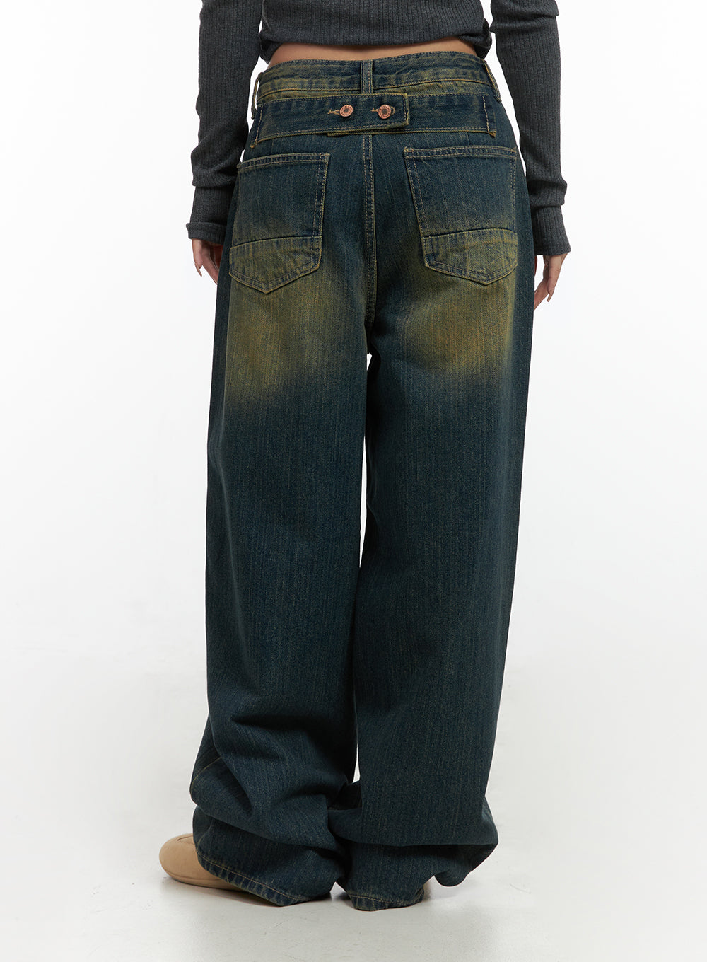 Georgia Vintage Wash Baggy Denim Jeans CO414 in dark blue, back mid-shot on model, large square back pockets with copper button hardware and yellow wash fading on wide baggy denim leg.