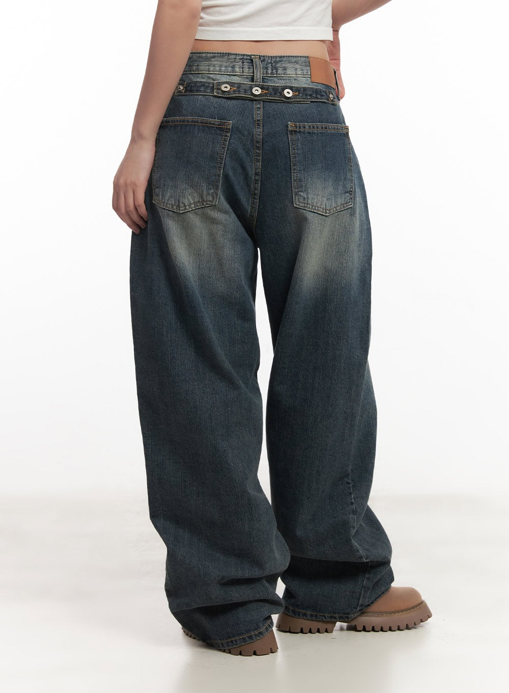 Leilani Washed Baggy Jeans CM531 in dark blue, back three-quarter view on model, wide-fit washed denim showing dual patch pockets and tan leather waistband label detail.