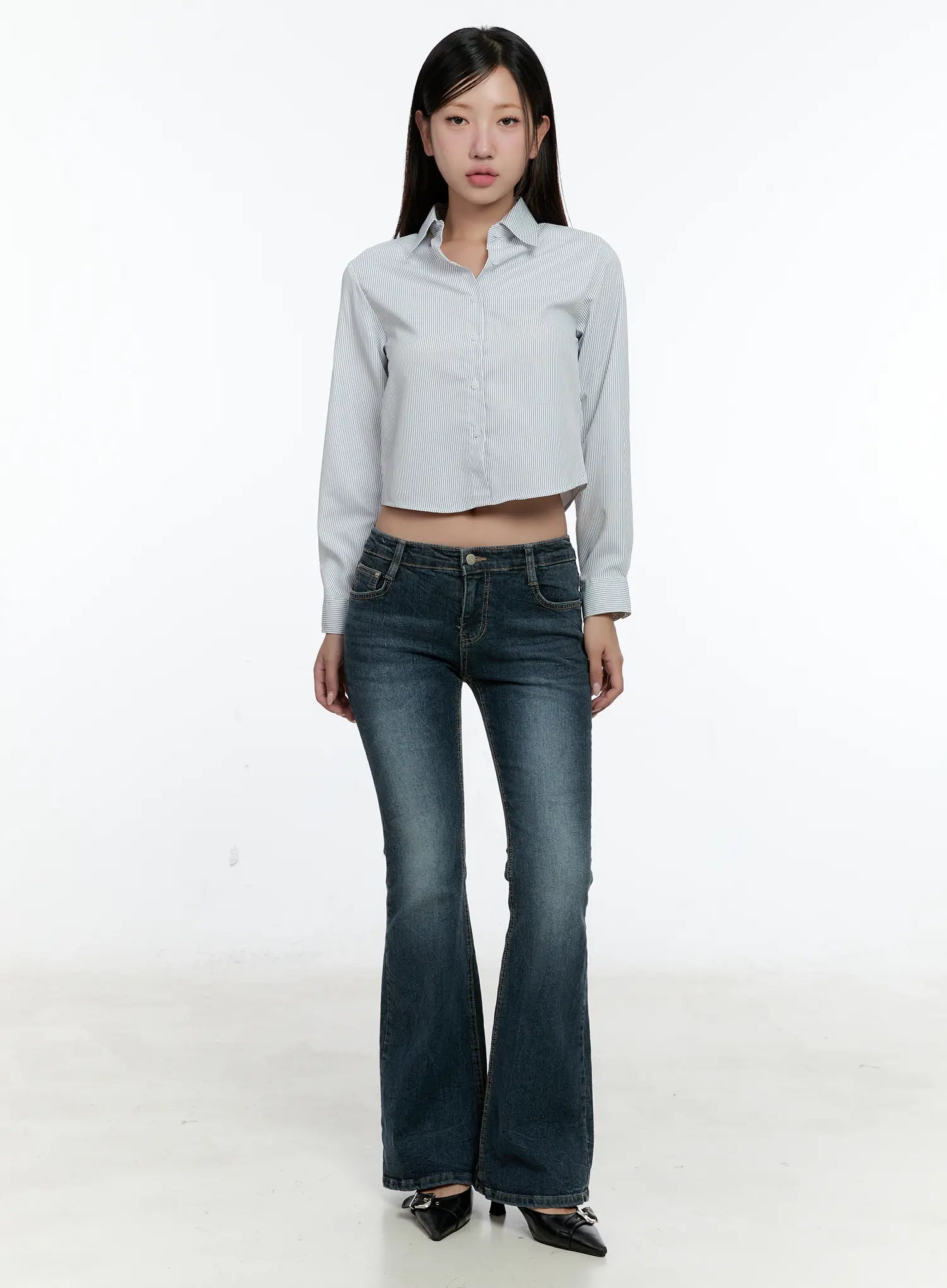 Harlee Bootcut Jeans CS517 in dark blue, full-length front outfit shot on second model, normal fit washed bootcut jeans styled with a cropped white shirt and black buckle heels.