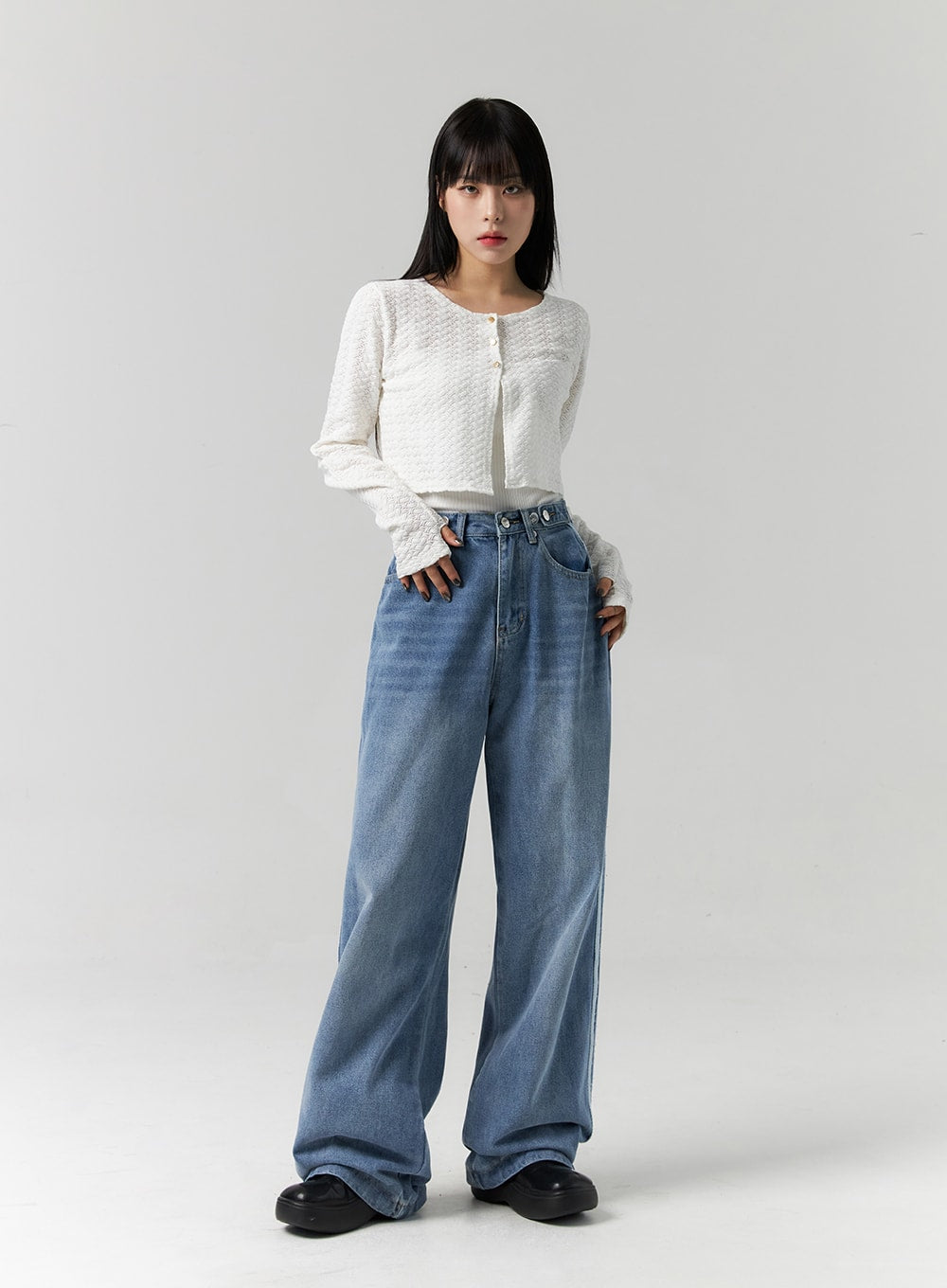 Side Stripes Wide Leg Jeans CS314 in blue, full-length front view on model hands at sides, washed wide-leg denim with high waist, styled with white textured cardigan and black chunky shoes.