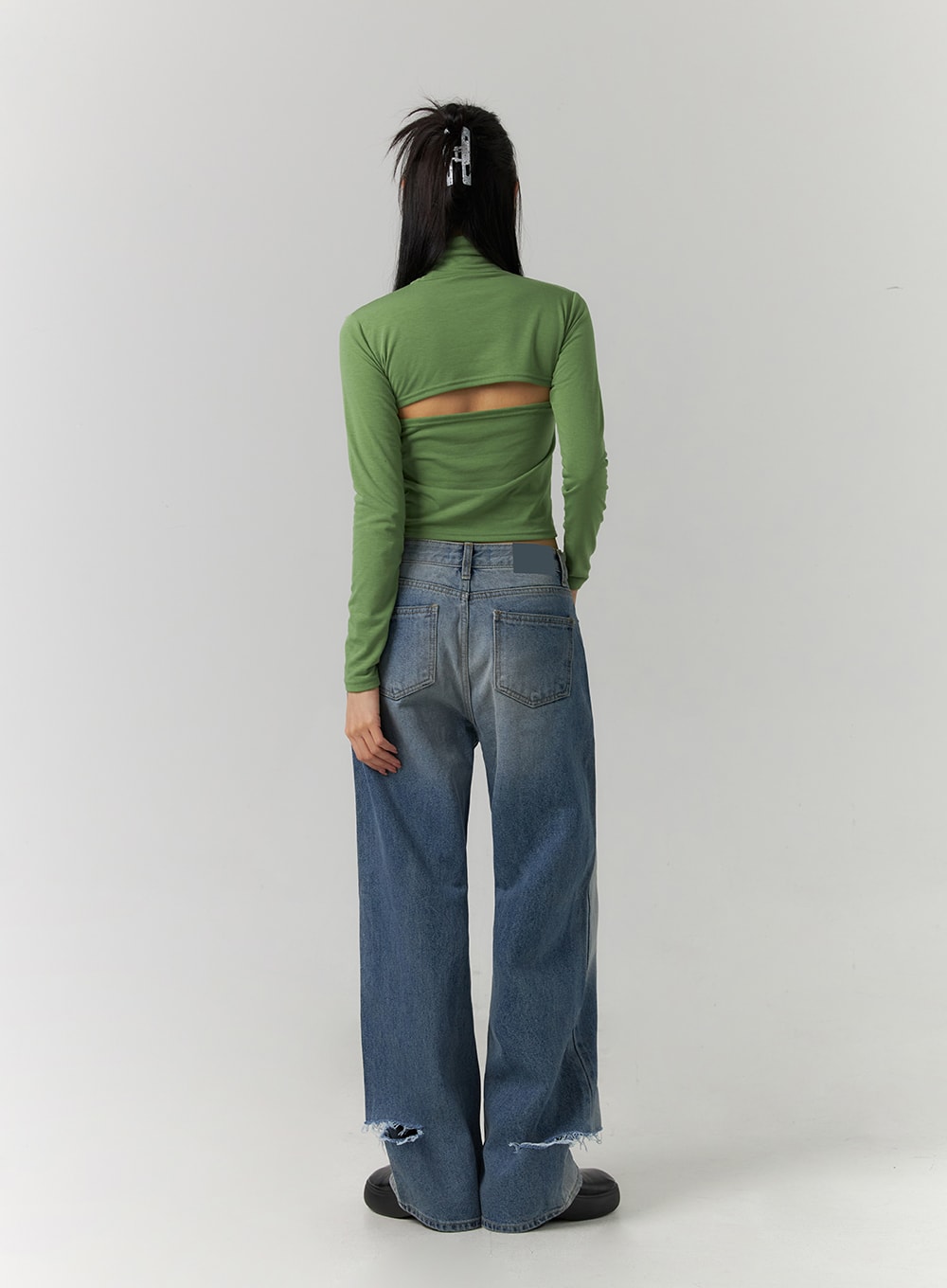 Ripped Straight Leg Jeans CD308 in blue, full back view on model, wide-leg washed denim with dual back pockets and destroyed frayed hem at ankle, styled with green cutout crop top.