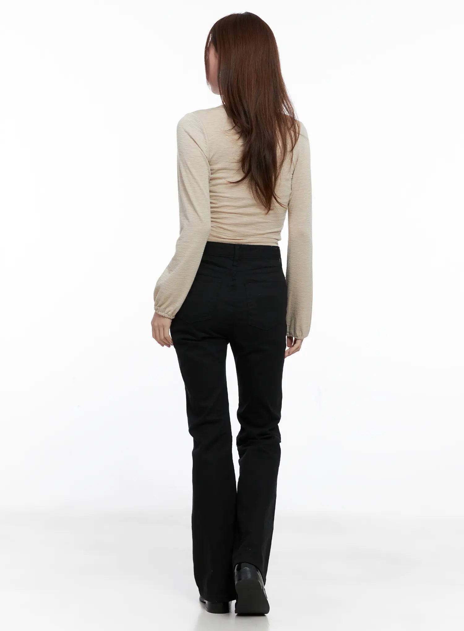 Casual Flare Cotton Pants CG521 in black, full back view on model styled with beige long-sleeve crop top, flare leg length and back pocket detail visible with black boots.