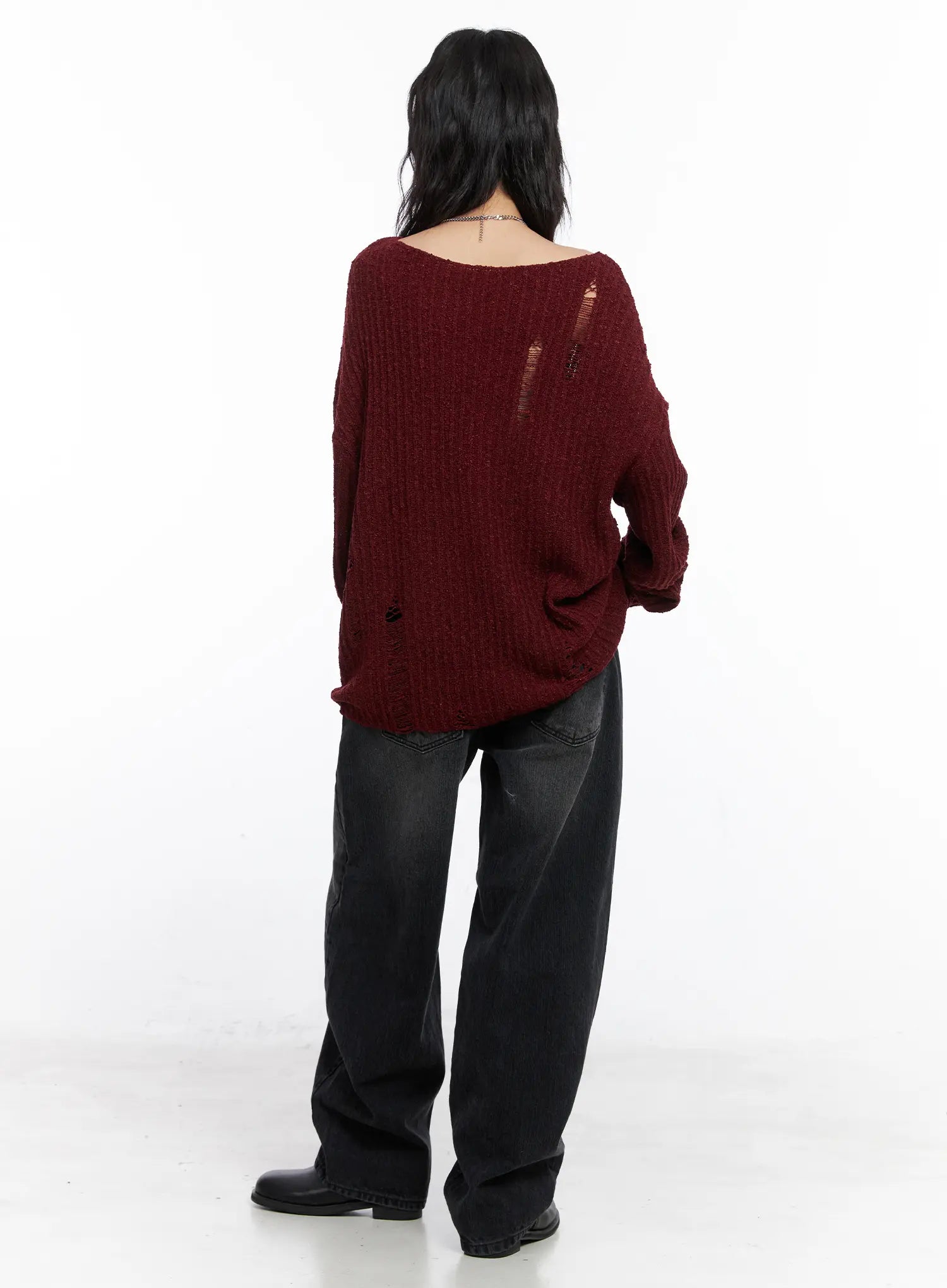 Ivey Washed Baggy Jeans CC1809 in black, back editorial full-length shot on model, wide-leg washed denim paired with burgundy distressed knit, back pocket detail visible.