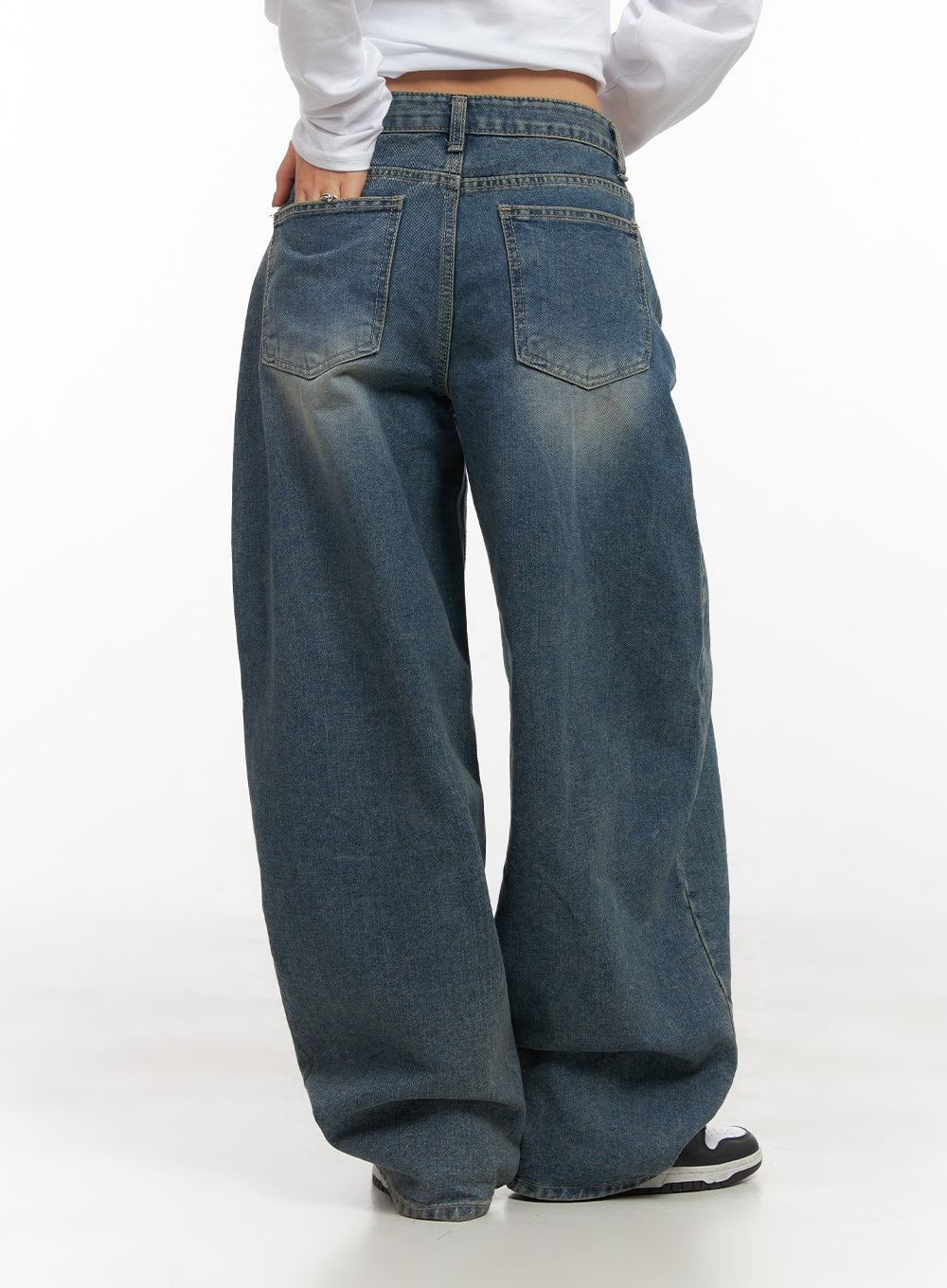 Mikaela Comfy Baggy Jeans CD411 in blue, back close-up from waist to hem on model, washed denim showing back patch pockets and faded wash detail, ultra-wide leg hem.