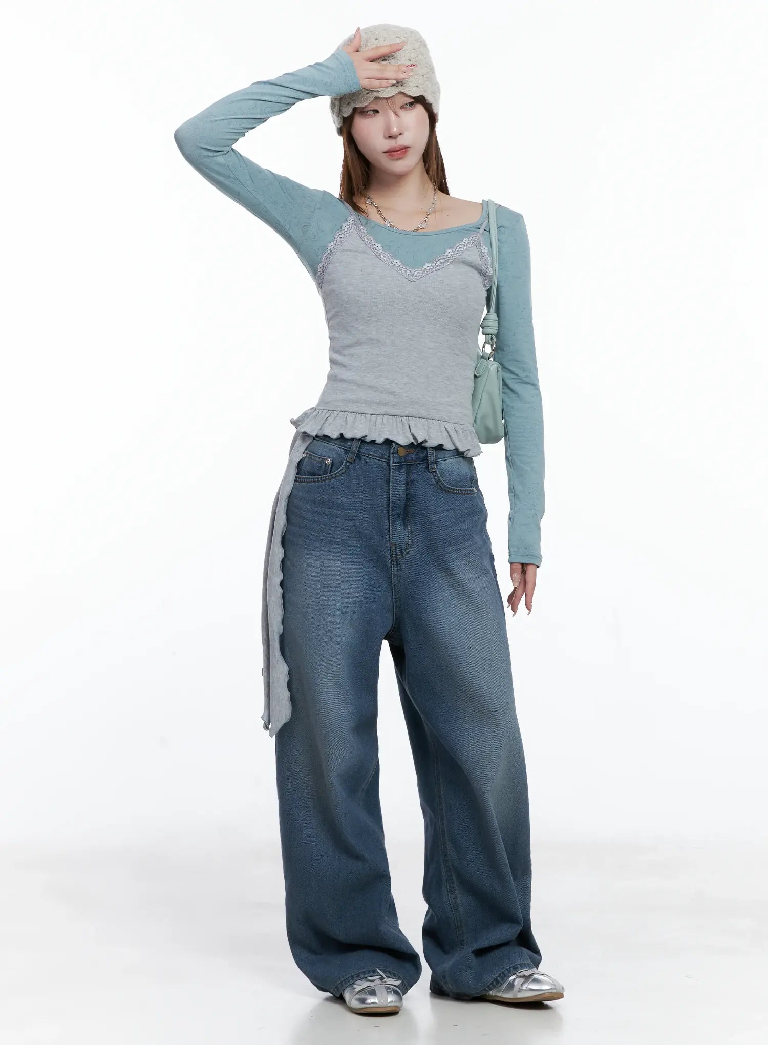 Margot Low-Rise Washed Wide-Leg Jeans CS501 in dark blue, full-body front on model in styled acubi outfit with lace cami, teal knit top, bucket hat, and mini shoulder bag.