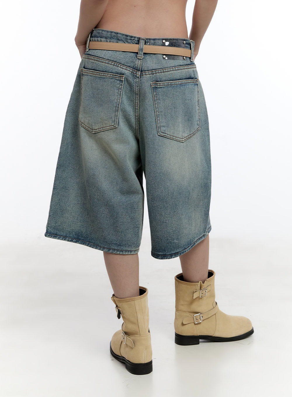 Washed Midi Baggy Jorts CY530 in blue, back close-up on model, dual back patch pockets with washed finish and tan belt detail, beige boots.
