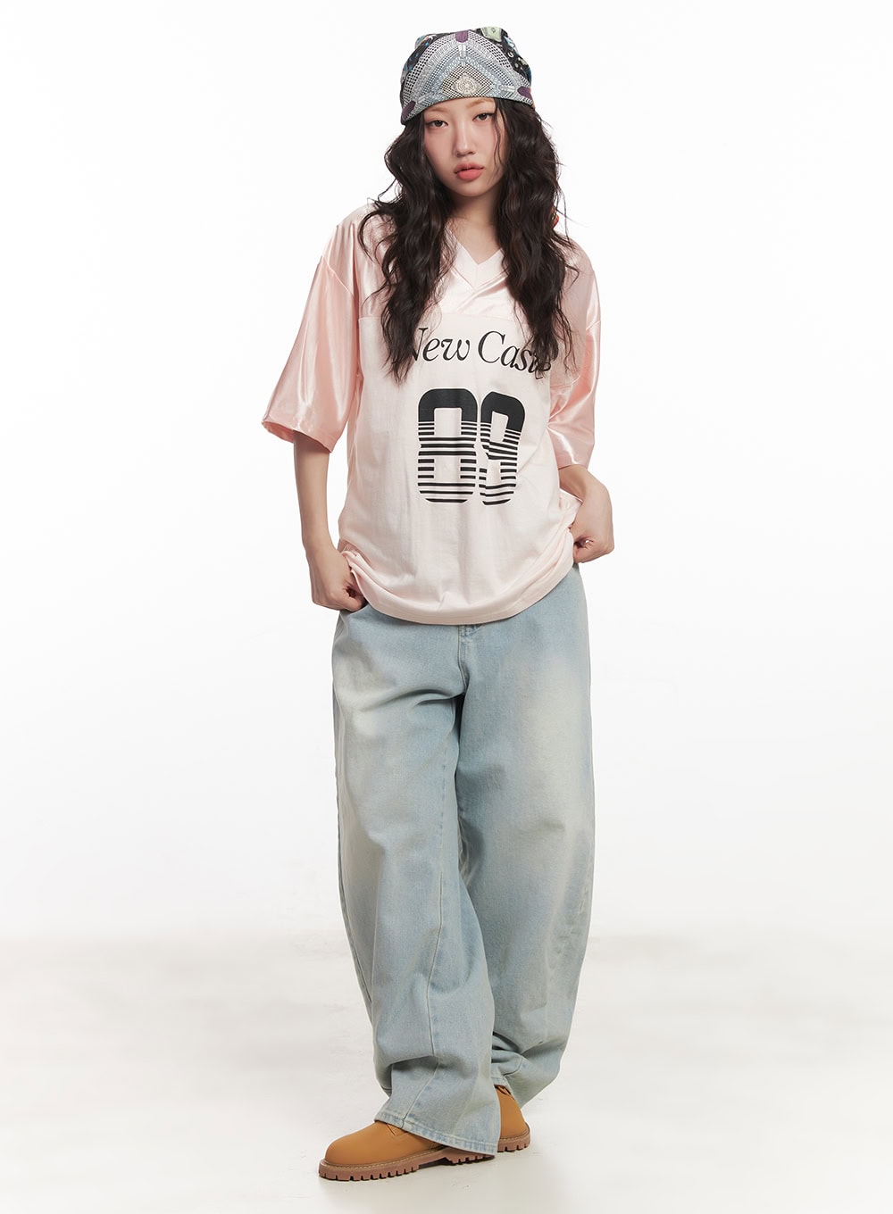 Alia Washed Wide-Leg Jeans CA518 in light blue, full-body front standing shot on model, relaxed wide fit with washed cotton denim, tucked-in graphic tee and tan chunky boots, street acubi style.