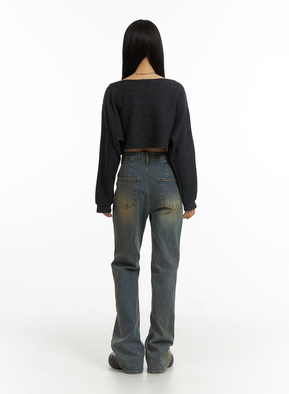Washed Slim Fit Bootcut Jeans CJ431 in blue, back view on model, showing dual back patch pockets with vintage yellow fading, slim fit silhouette and gentle bootcut flare, paired with grey crop knit.