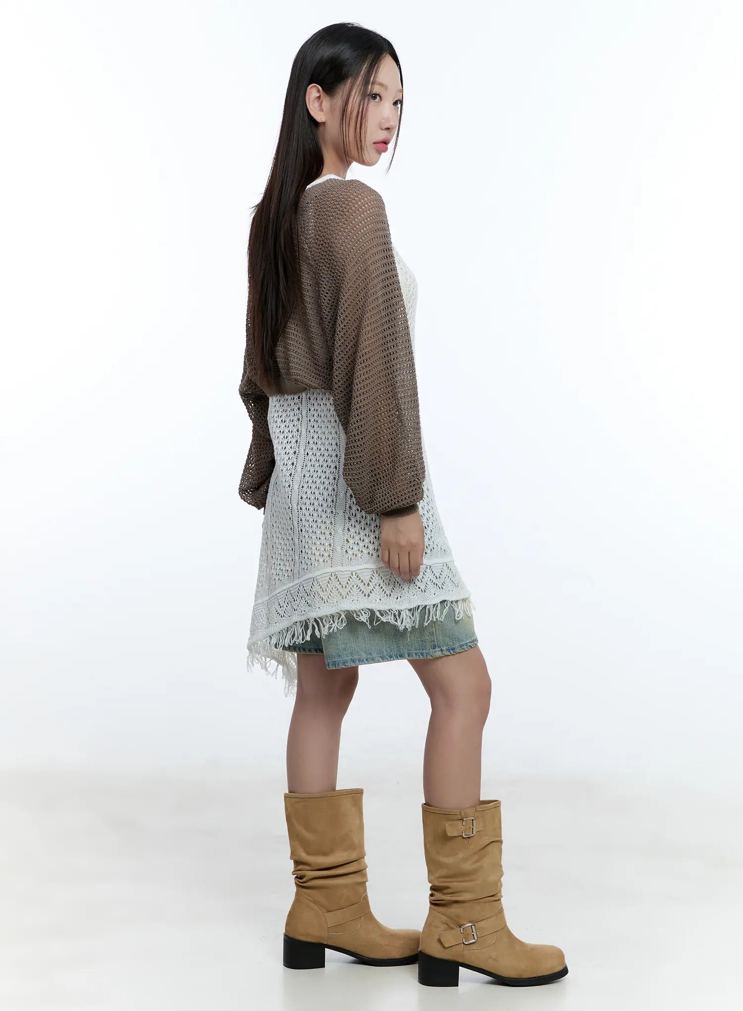 Vintage Wash Jorts CU527 in light blue, side full-body shot on model, denim hem visible beneath white crochet layered dress and open-knit brown cardigan, tan boots.
