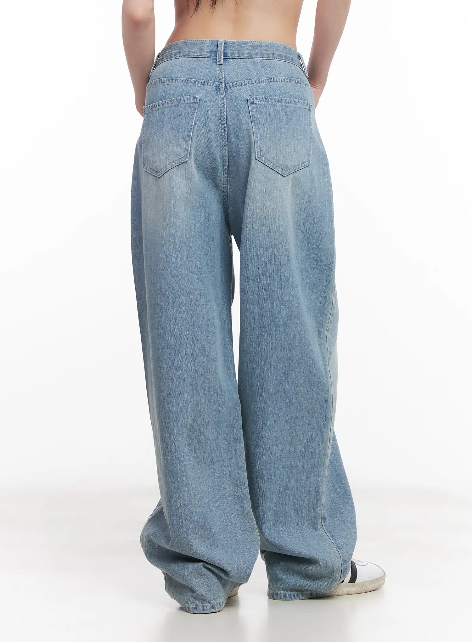 Rose Washed Baggy Summer Denim Jeans CU511 in light blue, back close-up view on model, wide-fit washed denim highlighting rear pocket placement, waistband seam, and faded wash detail.