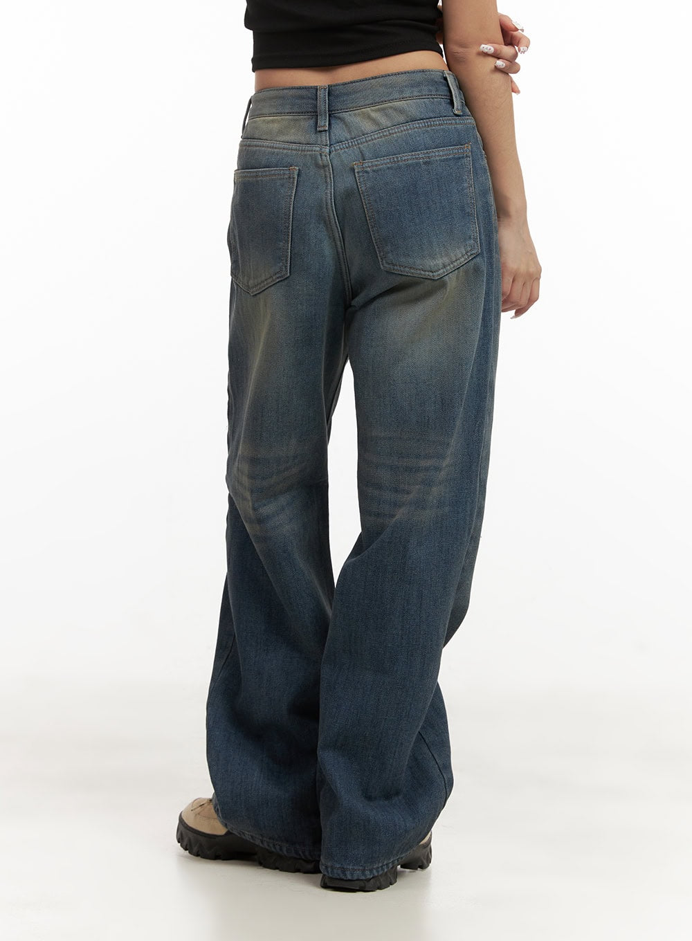 Michelle Washed Wide-Leg Jeans CJ508 in blue, back three-quarter shot on model, washed denim with back patch pockets and vintage fading, low-rise waistband detail visible.