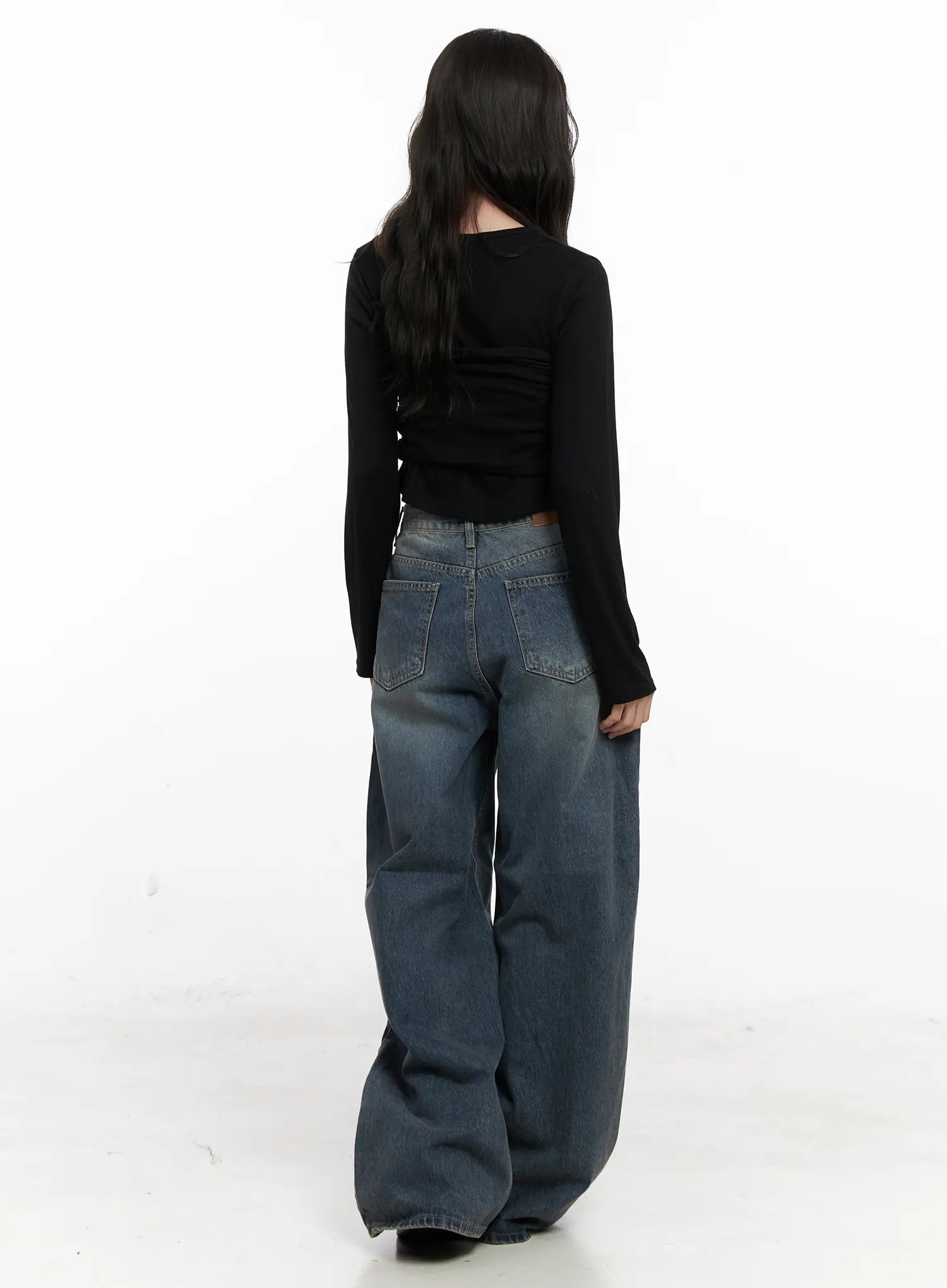 Tutt Washed Wide Leg Jeans CN504 in vintage blue, full back view on model, paired with black long-sleeve crop top, showing wide leg drape and back pocket placement.