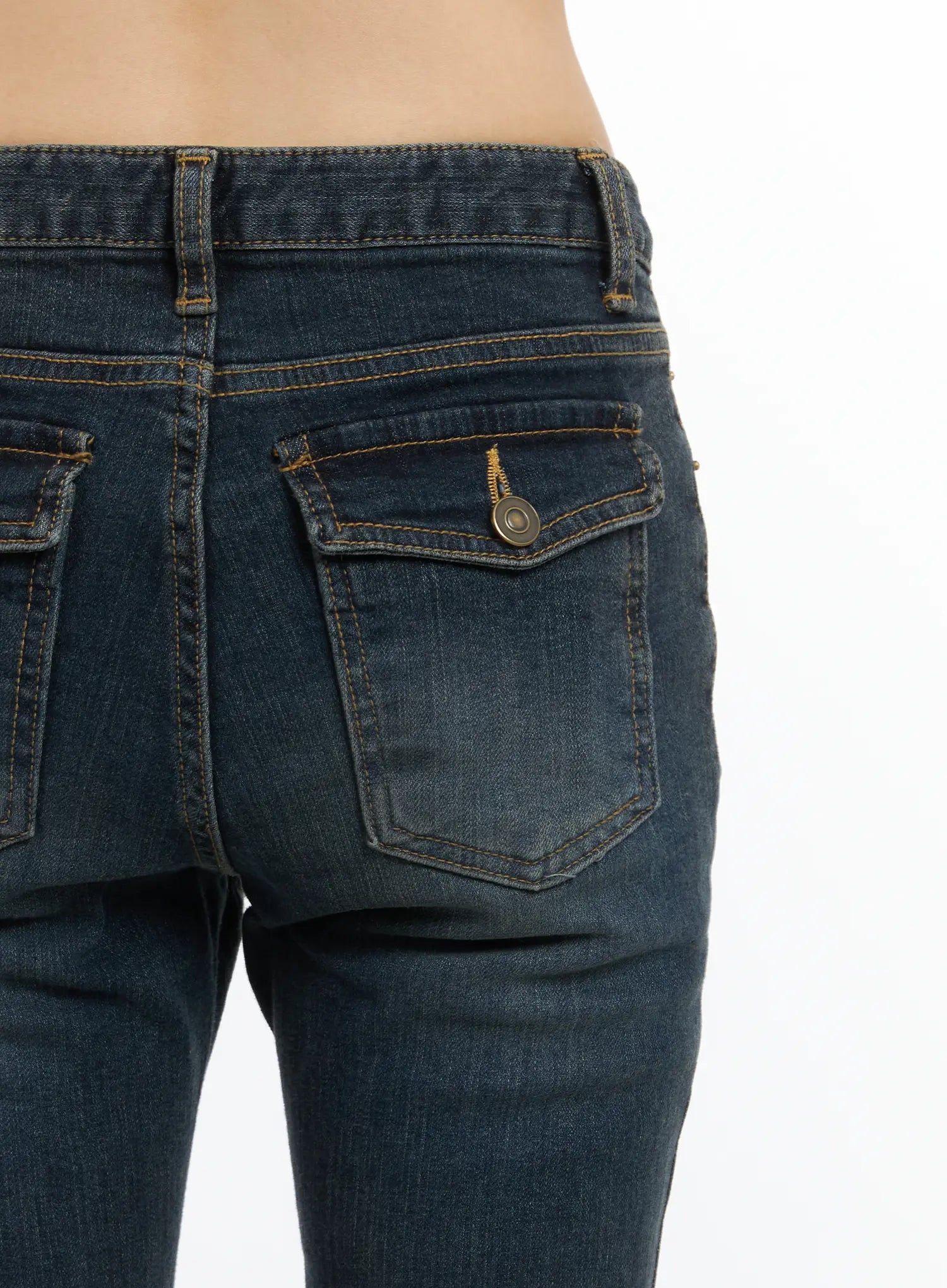 Kai Vintage Washed Flare Jeans CD515 in dark indigo, rear close-up detail of back pocket with flap and antique brass snap button, gold topstitching on washed denim.