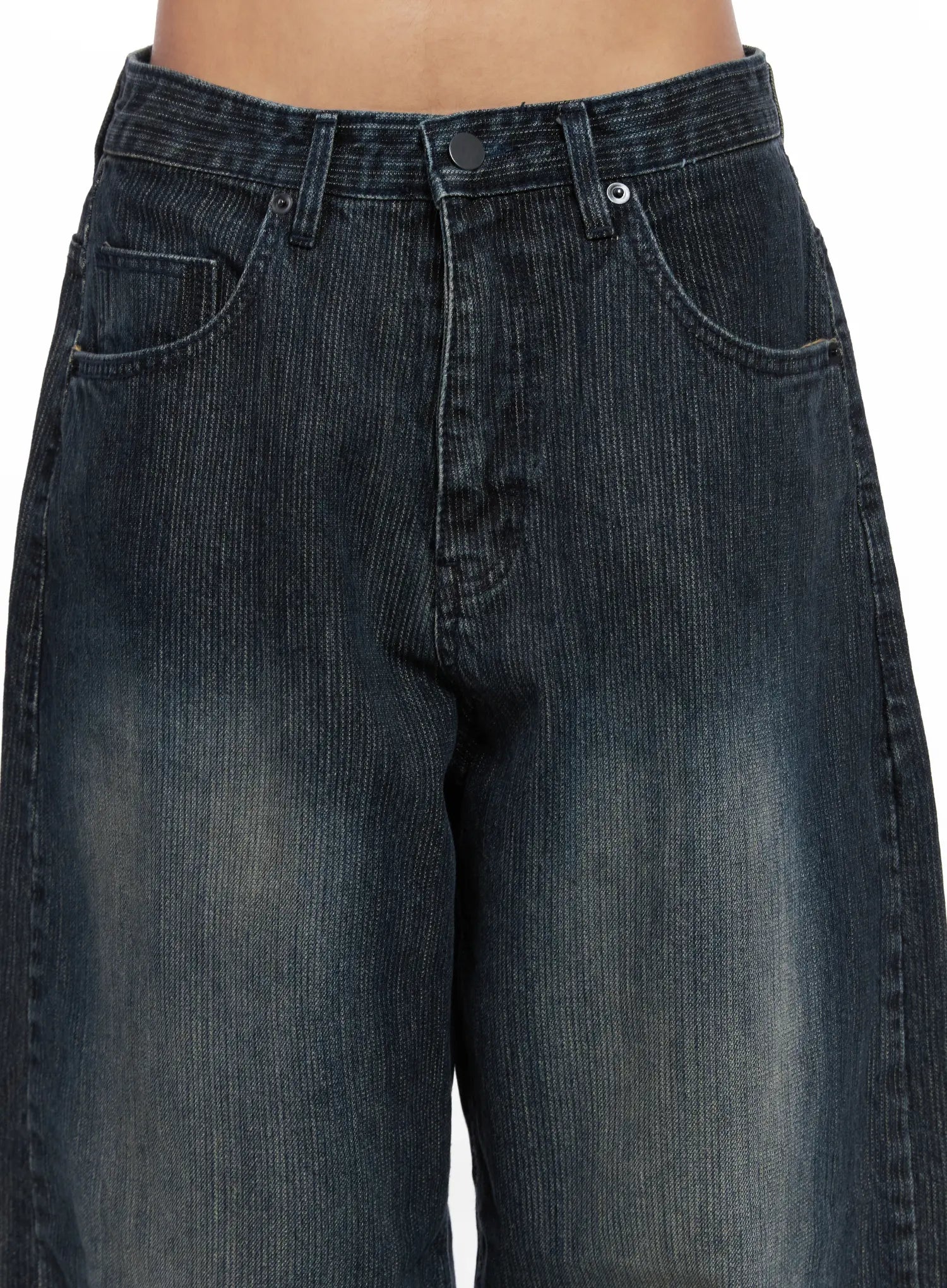 Aspyn Wide-Leg Washed Corduroy Jeans CO510 in dark blue, close-up detail of waistband and front pockets on model, corduroy ribbed texture and washed fading clearly shown, button fly.