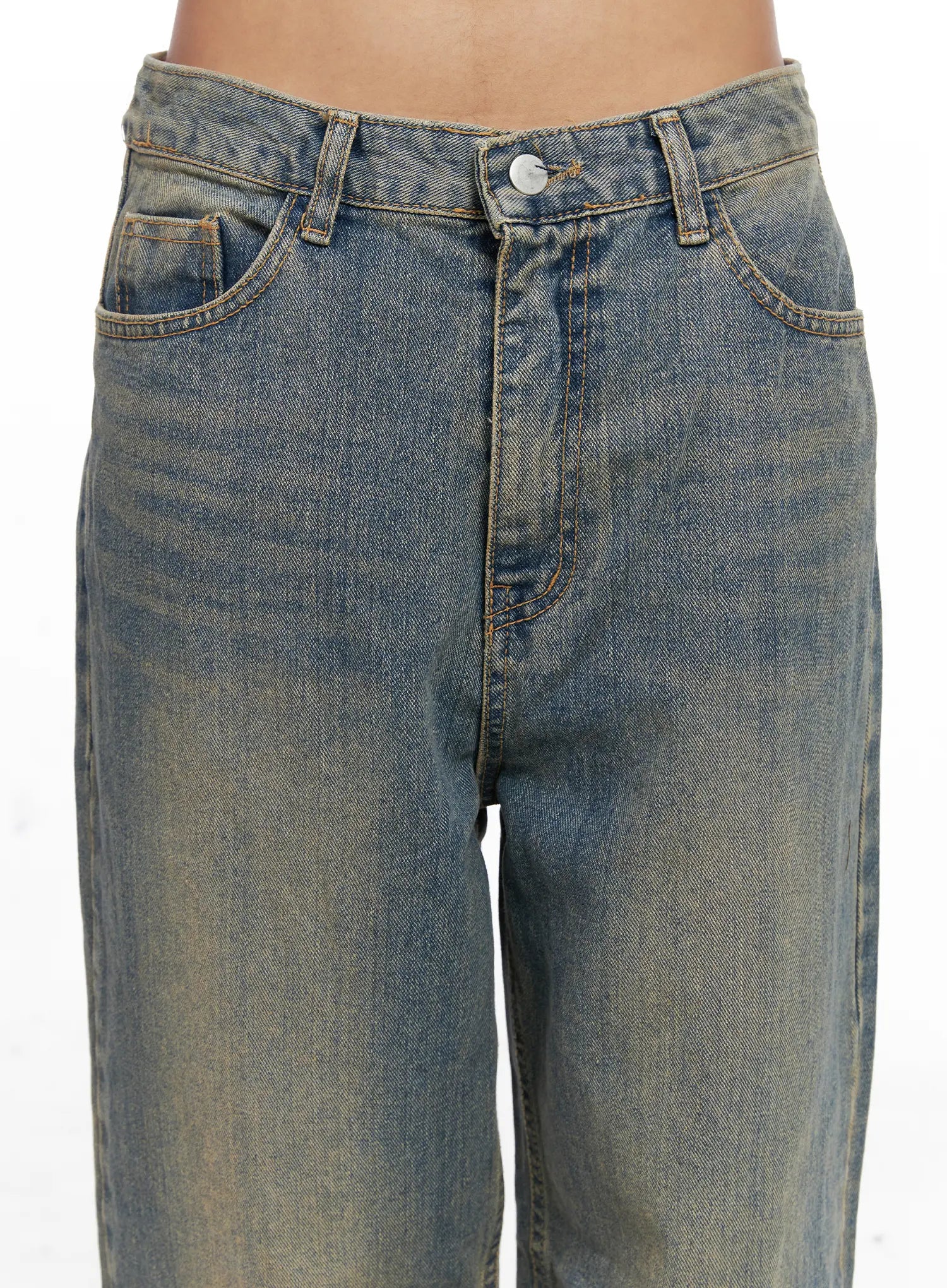 Denver Vintage Washed Semi-Wide Jeans CO513 in blue, front waist close-up on model showing button closure, coin pocket, front pockets, and vintage washed denim texture with golden tonal fade.