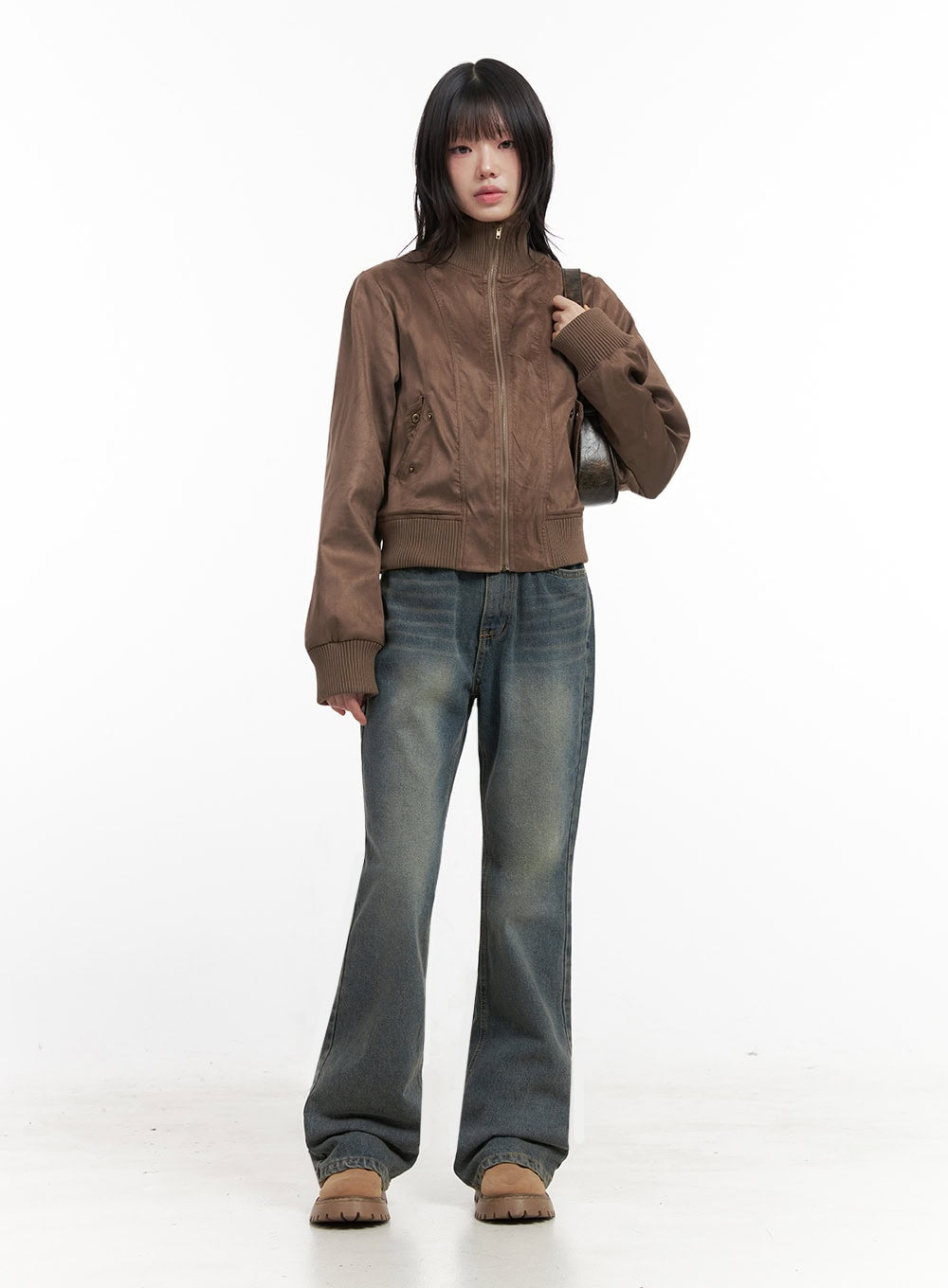 Asher Slimline Washed Bootcut Jeans ID402 in vintage blue, front full-length shot on model, slim bootcut silhouette with faded washed denim, paired with brown zip-up bomber jacket and tan boots.